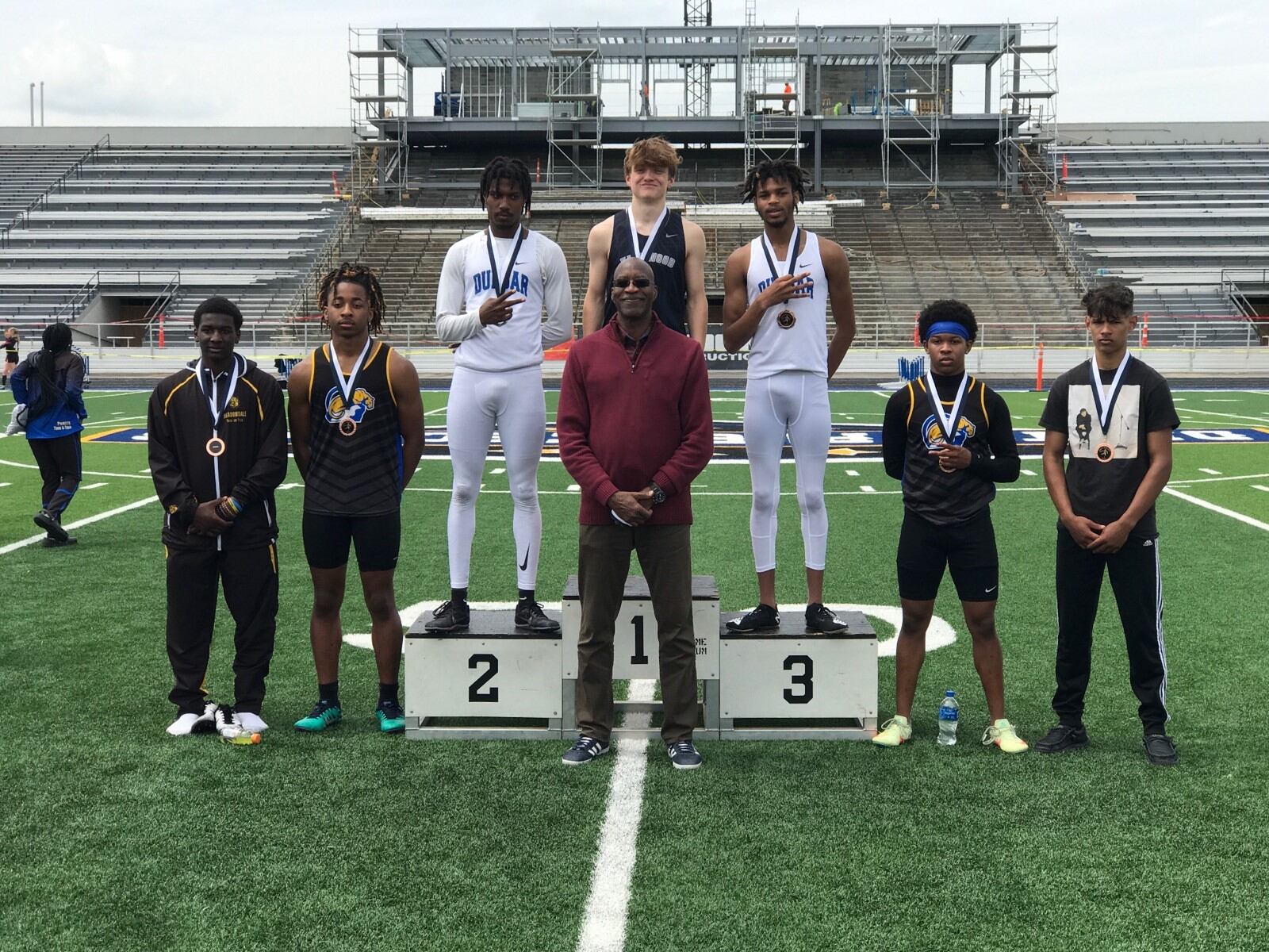 Edwin Moses with the 400 hurdles placers on Saturday at the Edwin C. Moses Relays at Welcome Stadium. Edgewood senior Jacob Crowthers won the event. Tom Archdeacon/CONTRIBUTED