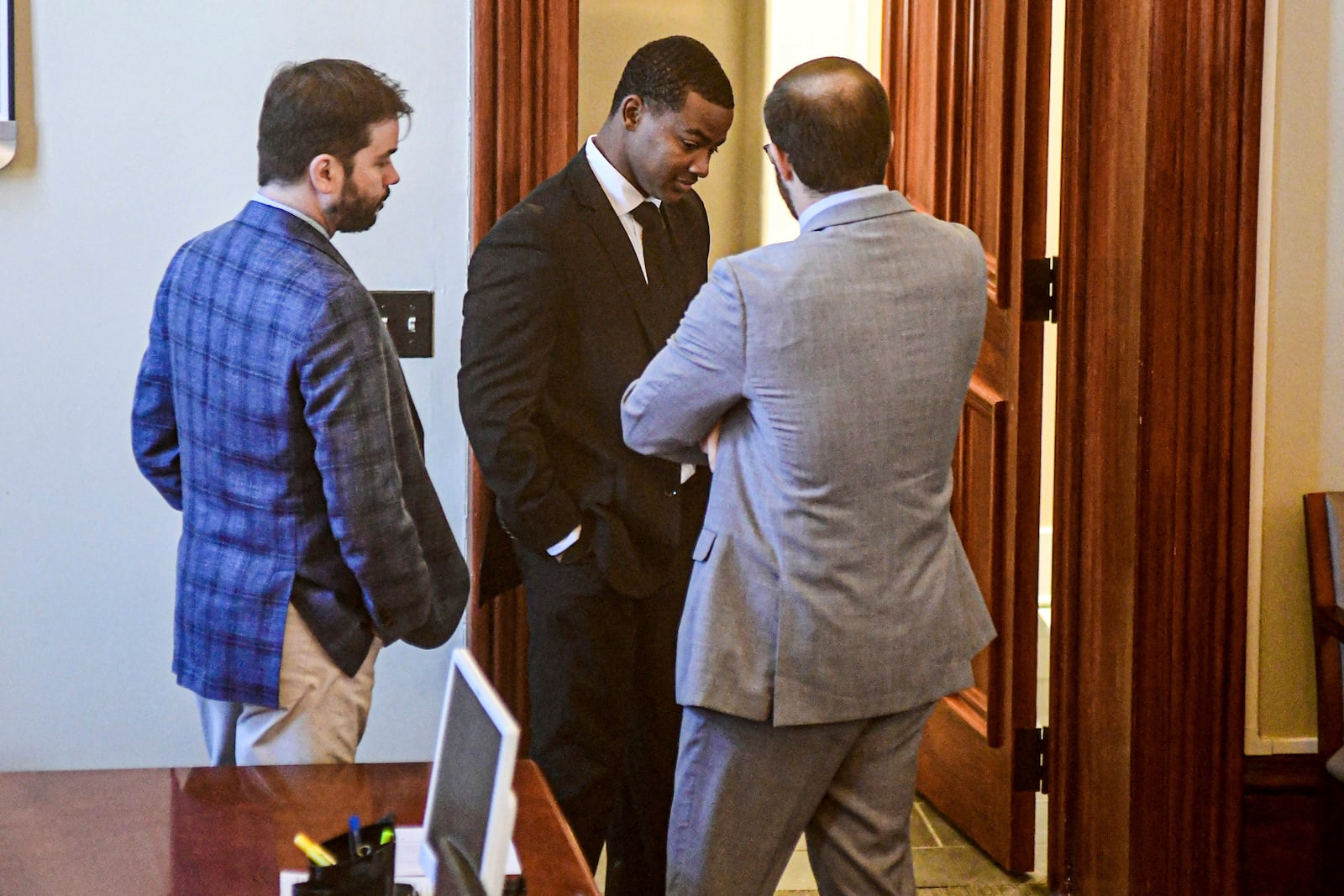 Sheldon Timothy Herrington Jr., center, who is on trial for the murder of University of Mississippi student Jimmie "Jay" Lee, talks with his attorneys as the jury deliberates on the case, at the Lafayette County Courthouse in Oxford, Miss. on Wednesday, Dec. 11, 2024. (Bruce Newman/The Northeast Mississippi Daily Journal via AP, Pool)