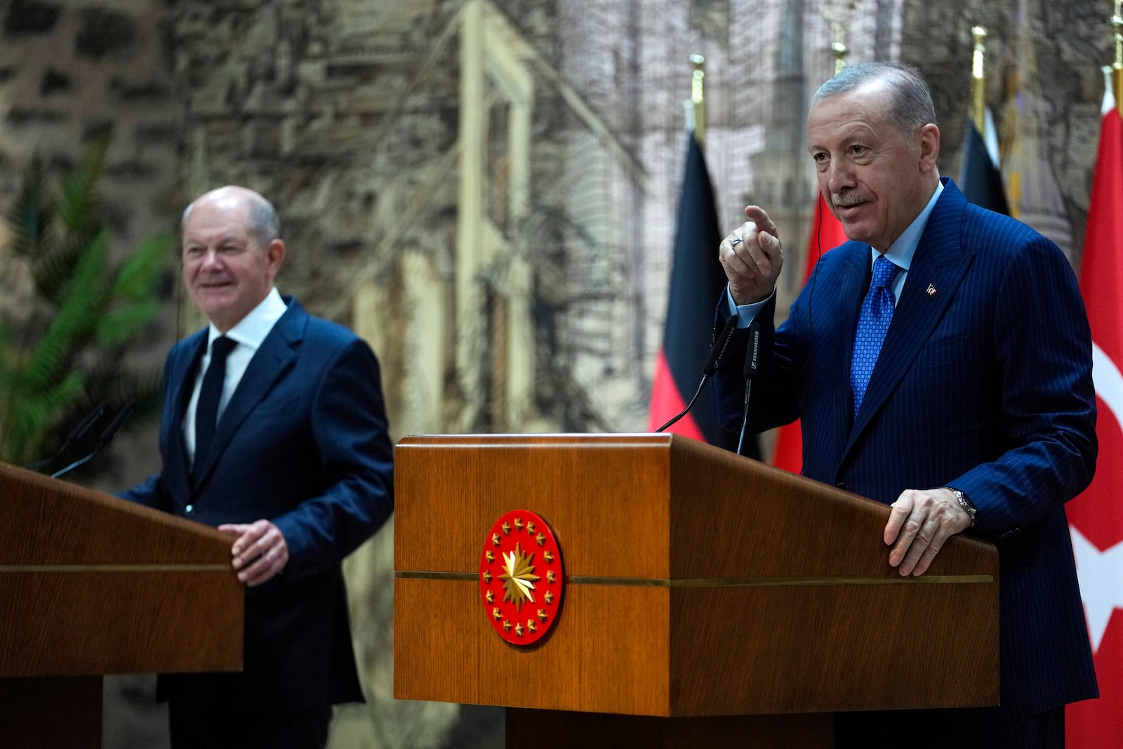 Turkey's President Recep Tayyip Erdogan, right, hold a press conference with Germany's Chancellor Olaf Scholz, in Istanbul, Turkey, Saturday, Oct. 19, 2024. (AP Photo/Khalil Hamra)