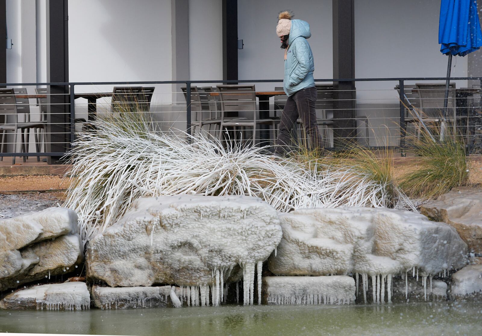 Cold temperatures freeze water in a fountain in Allen, Texas, Thursday, Feb. 20, 2025. (AP Photo/LM Otero)