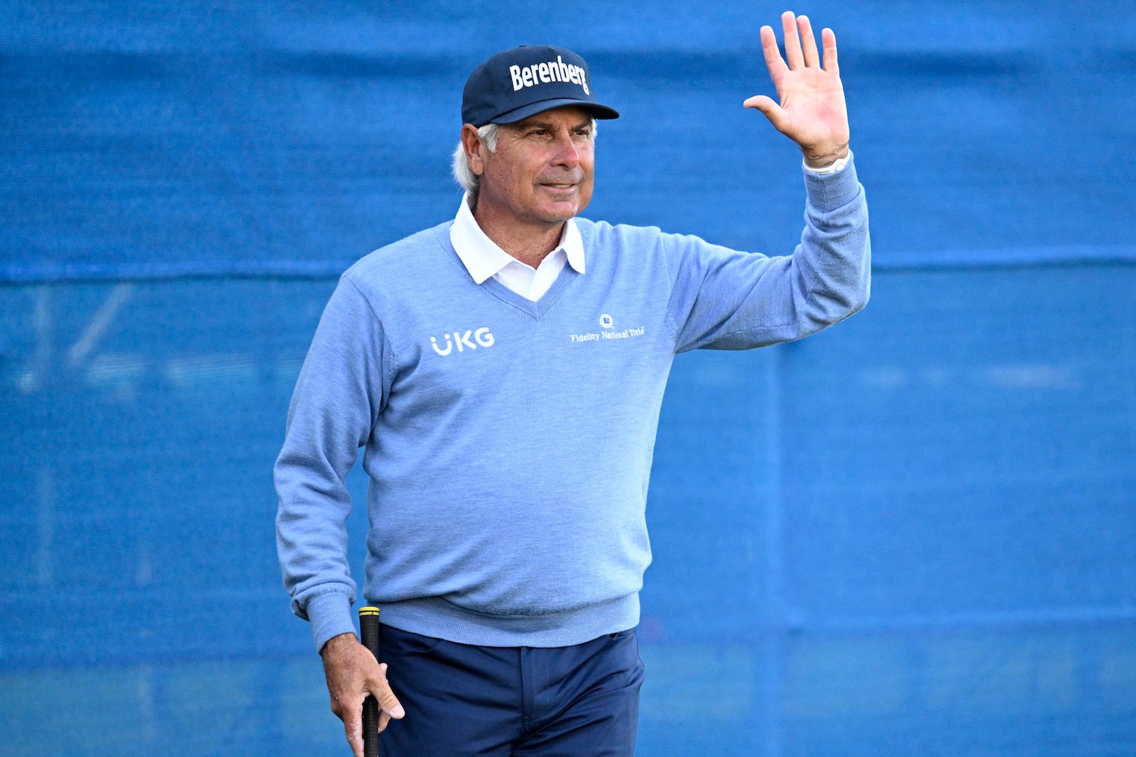 Fred Couples acknowledges the crowd after chipping onto the 18th green during the first round of the PNC Championship golf tournament, Saturday, Dec. 21, 2024 in Orlando. (AP Photo/Phelan M. Ebenhack)