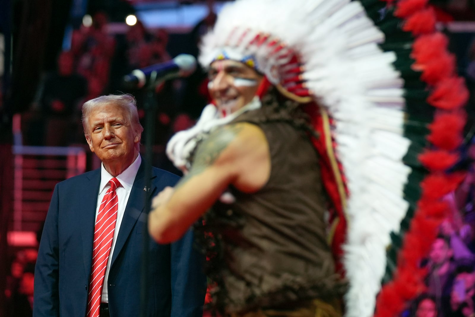 President-elect Donald Trump watches The Village People perform at a rally ahead of the 60th Presidential Inauguration, Sunday, Jan. 19, 2025, in Washington. (AP Photo/Evan Vucci)