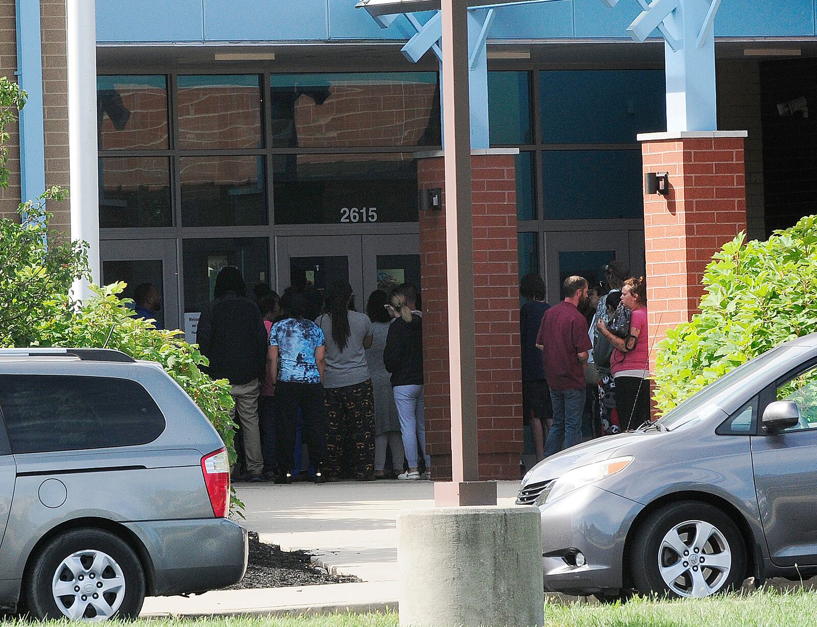 Parents were seen outside Belmont High School after Dayton police received a false report of an active shooter Friday, Sept. 23, 2022. MARSHALL GORBY / STAFF