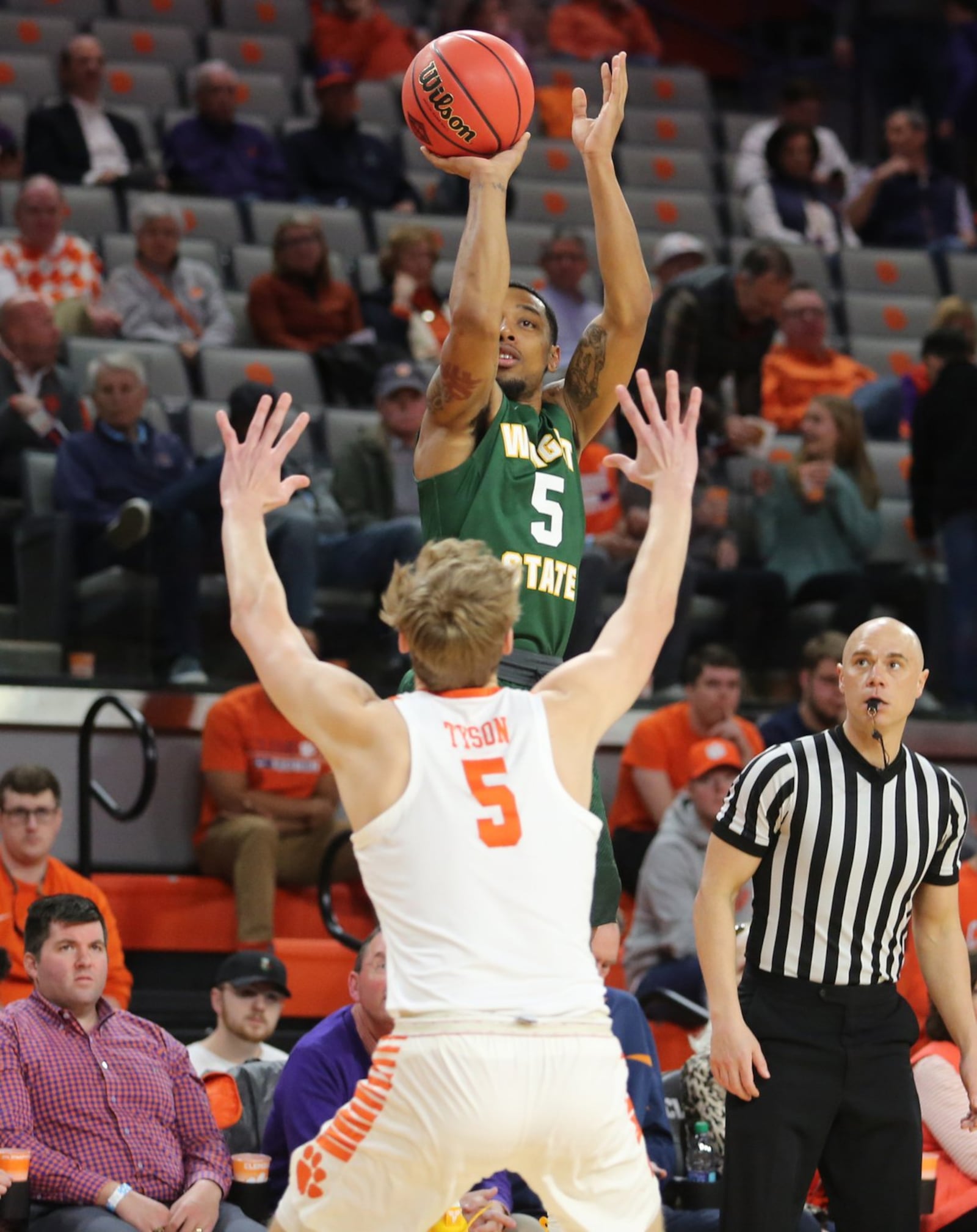 Wright State’s Skyelar Potter shoots over Clemson’s Hunter Tyson during Tuesday night’s NIT game at Littlejohn Coliseum in Clemson, S.C. Clemson won 75-69. PHOTO COURTESY OF CLEMSON ATHLETICS