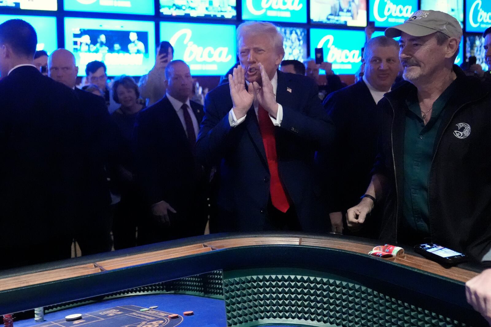 President Donald Trump stands at a craps table after speaking about the economy at the Circa Resort and Casino in Las Vegas, Saturday, Jan. 25, 2025. (AP Photo/Mark Schiefelbein)