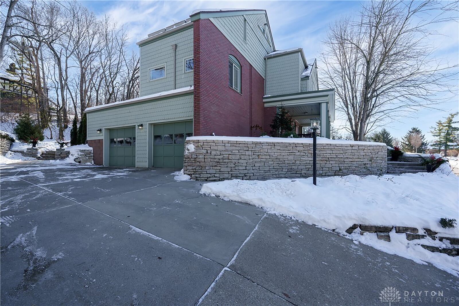 The two car side entry garage has extended storage and workshop space.