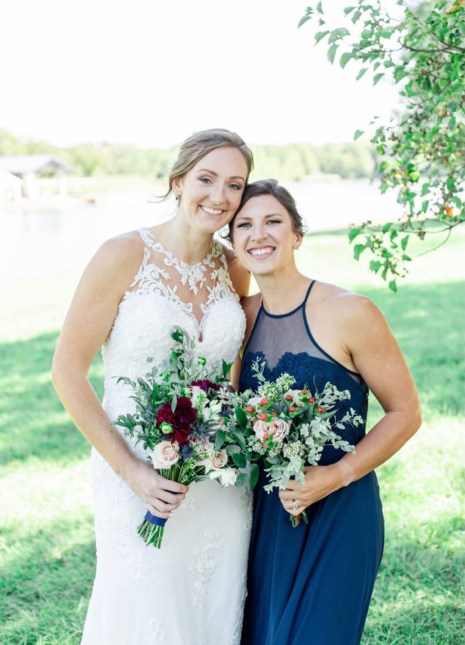 University of Dayton Hall of Fame basketball player and former WNBA player Ally Malott McCarthy on her wedding day last September with bridesmaid and longtime friend, Andrea Hoover, also University of Dayton Hall of Fame basketball player and former WNBA player.   (CONTRIBUTED PHOTO)