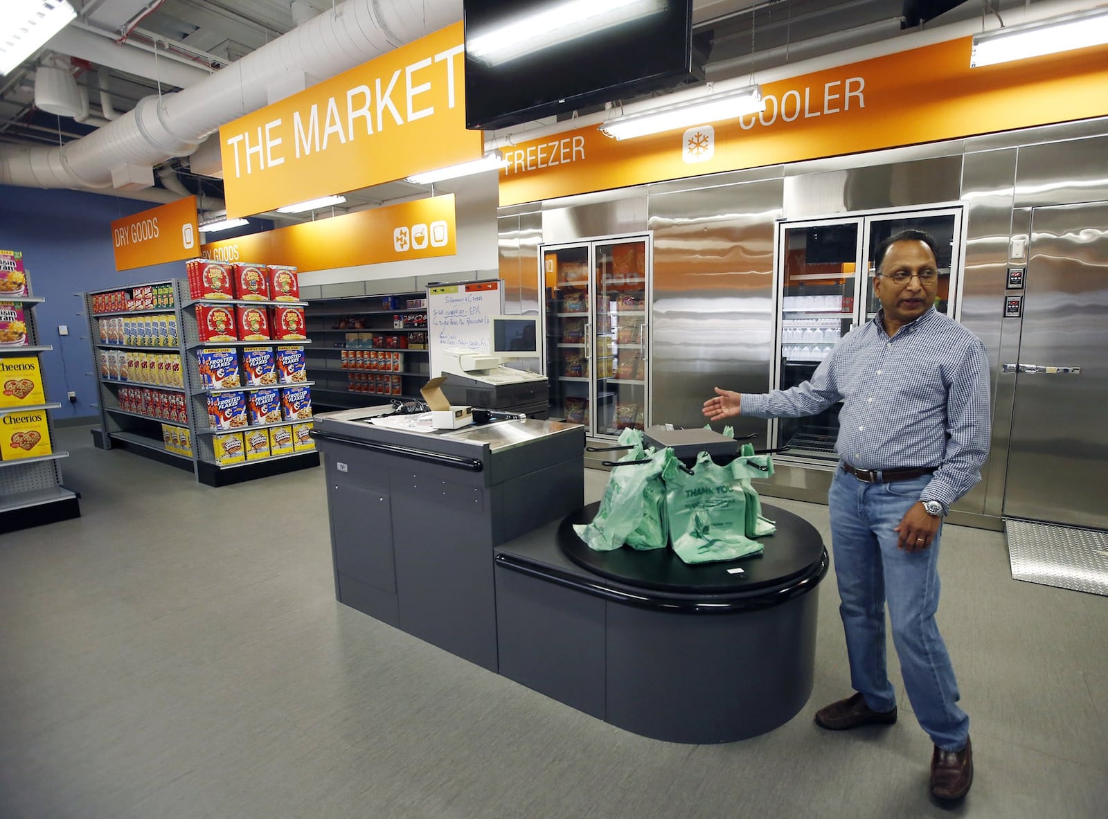 Rajan Rajendran, Emerson vice president, systems innovation and sustainability, talks about the Martket at Emerson Climate Technologies Helix Innovation Center. The Market is loaded with sensors to monitor the climate and performance of the coolers. The HVAC system is also monitored for performance and energy consumption. TY GREENLEES / STAFF