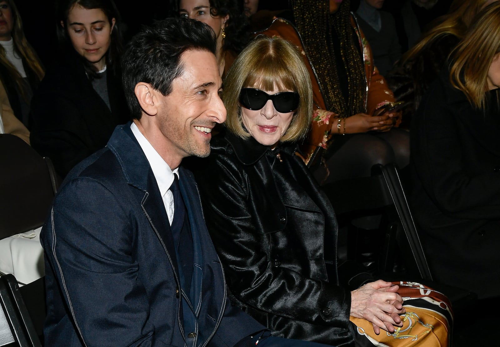 Adrien Brody, left, and Anna Wintour attend the Thom Browne Fall/Winter 2025 fashion show as part of New York Fashion Week on Tuesday, Feb. 11, 2025, at The Shed in New York. (Photo by Evan Agostini/Invision/AP)