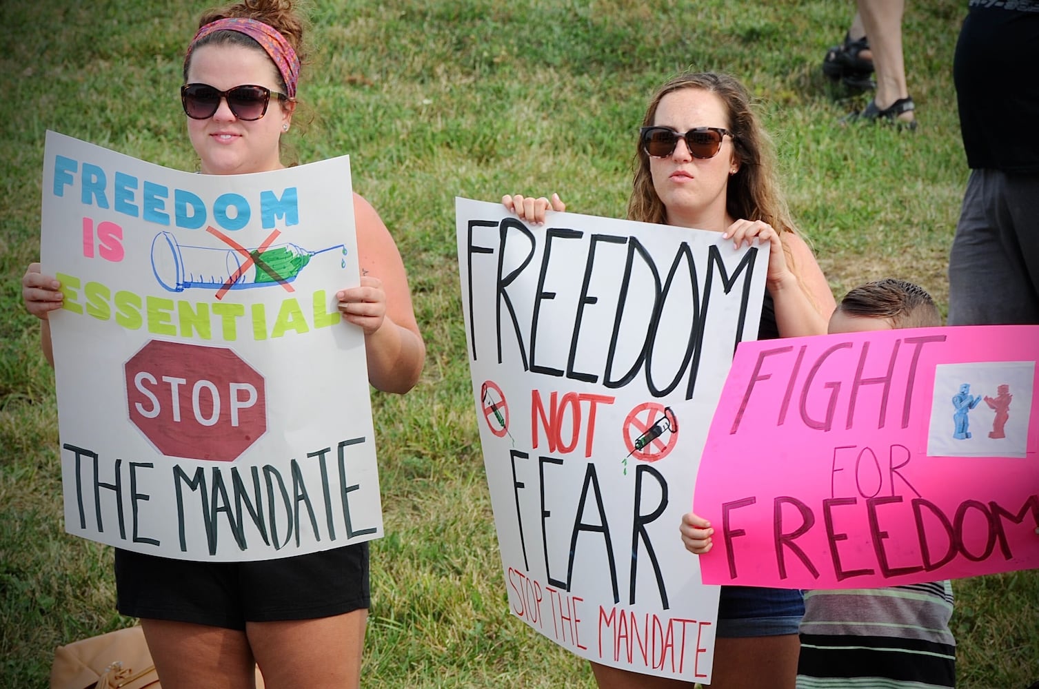 PHOTOS: Crowd gathers to protest COVID vaccine at Kettering Health