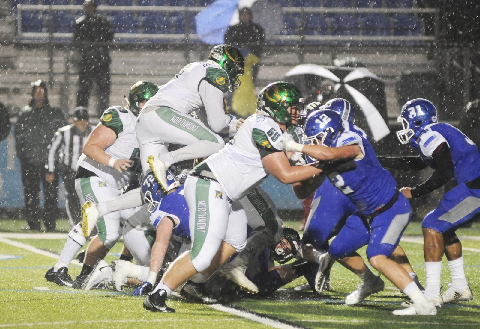 Northmont running back Jestin Jacobs goes airborne to get a late first down. Northmont defeated host Miamisburg 21-6 in a Week 10 high school football game on Friday, Oct. 26, 2018. MARC PENDLETON / STAFF