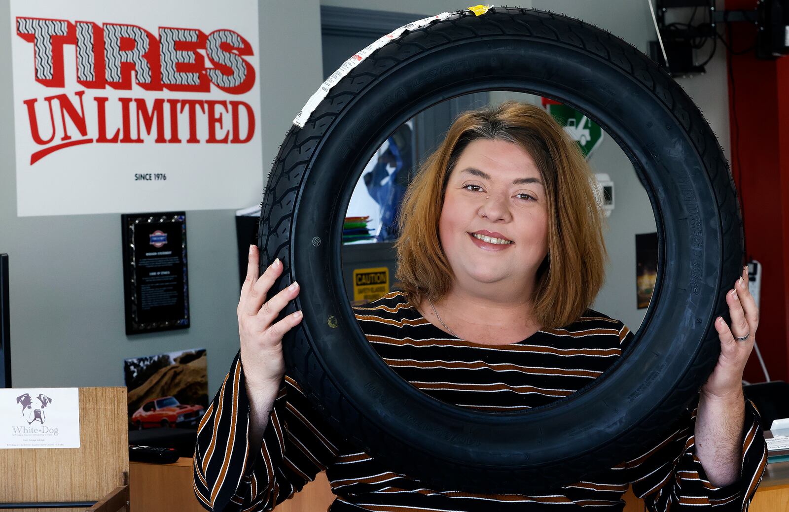 Courtney Carlisle, owner of Moraine's Tires Unlimited located at 3578 Kettering Blvd. in Moraine. MARSHALL GORBY\STAFF