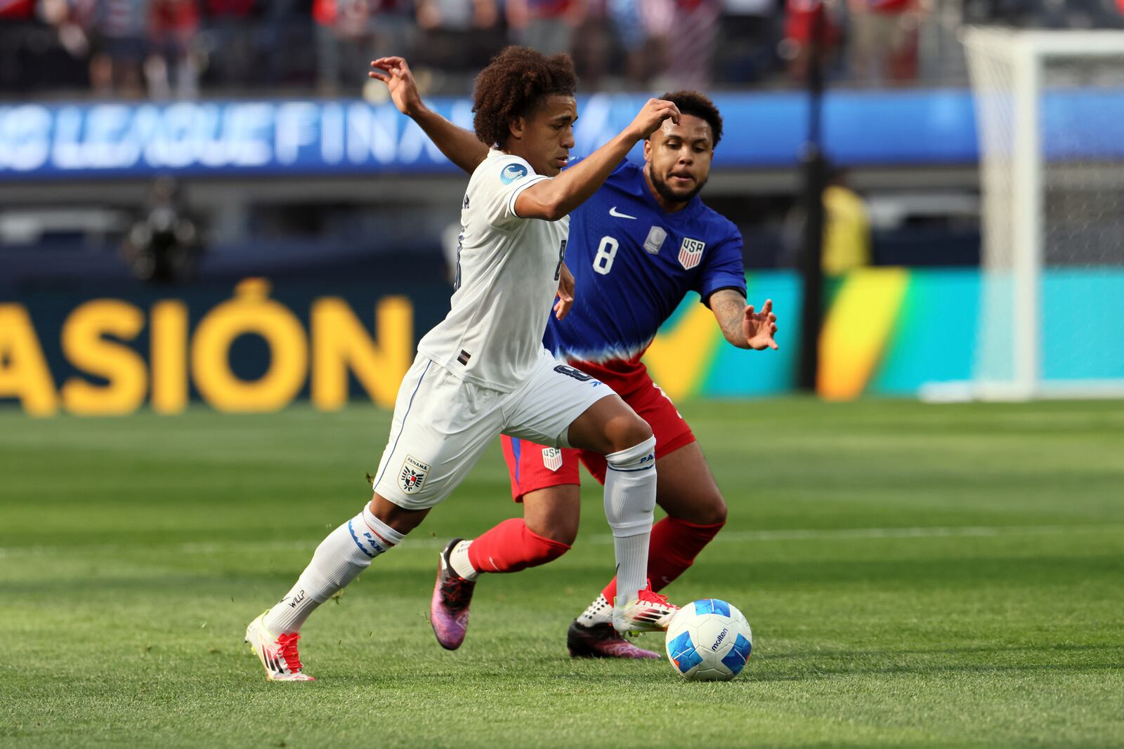 Panama's Adalberto Carrasquilla Alcazar, left, dribbles past United States' Weston Mc Kennie (8) during the first half of a CONCACAF Nations League semifinal soccer match Thursday, March 20, 2025, in Inglewood, Calif. (AP Photo/Etienne Laurent)