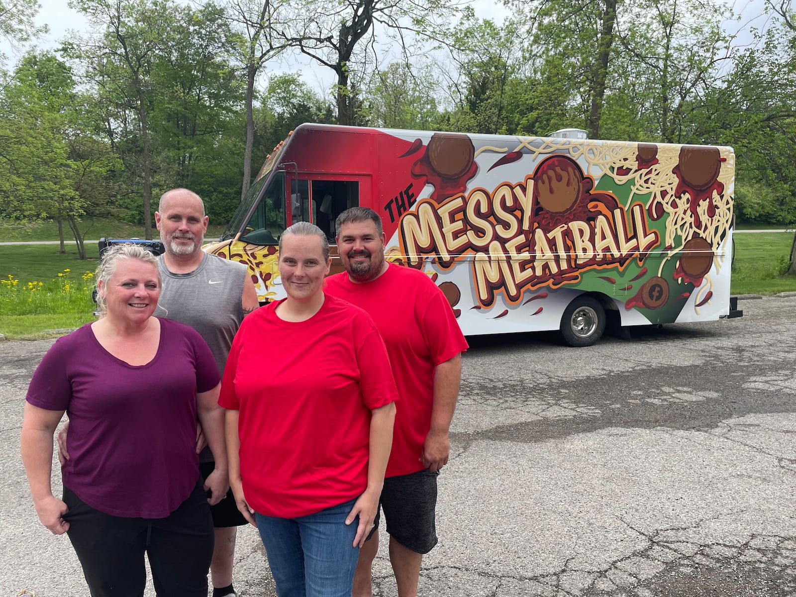 Pictured left to right are Crystal Moberly, Donnie Moberly, Angela Ashburn and  Jeremy Vanmeter, who operate The Messy Meatball and DC's Burgers & More food trucks. NATALIE JONES/STAFF