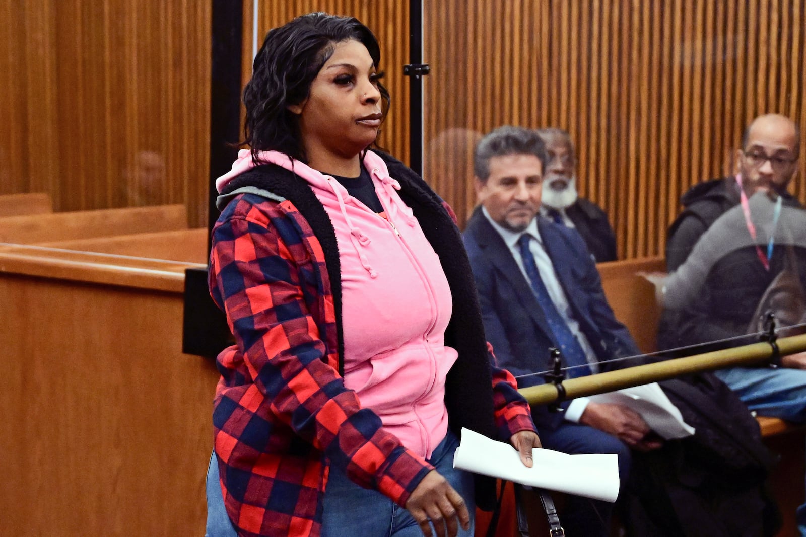 Fiona Allen walks toward the bench for her arraignment in Cuyahoga County Common Pleas Court, Tuesday, Dec. 3, 2024, in Cleveland. Allen is accused of illegally voting in five different elections since 2020. Though Allen is a legal resident of the United States, prosecutors say she is not an American citizen. (AP Photo/David Dermer)