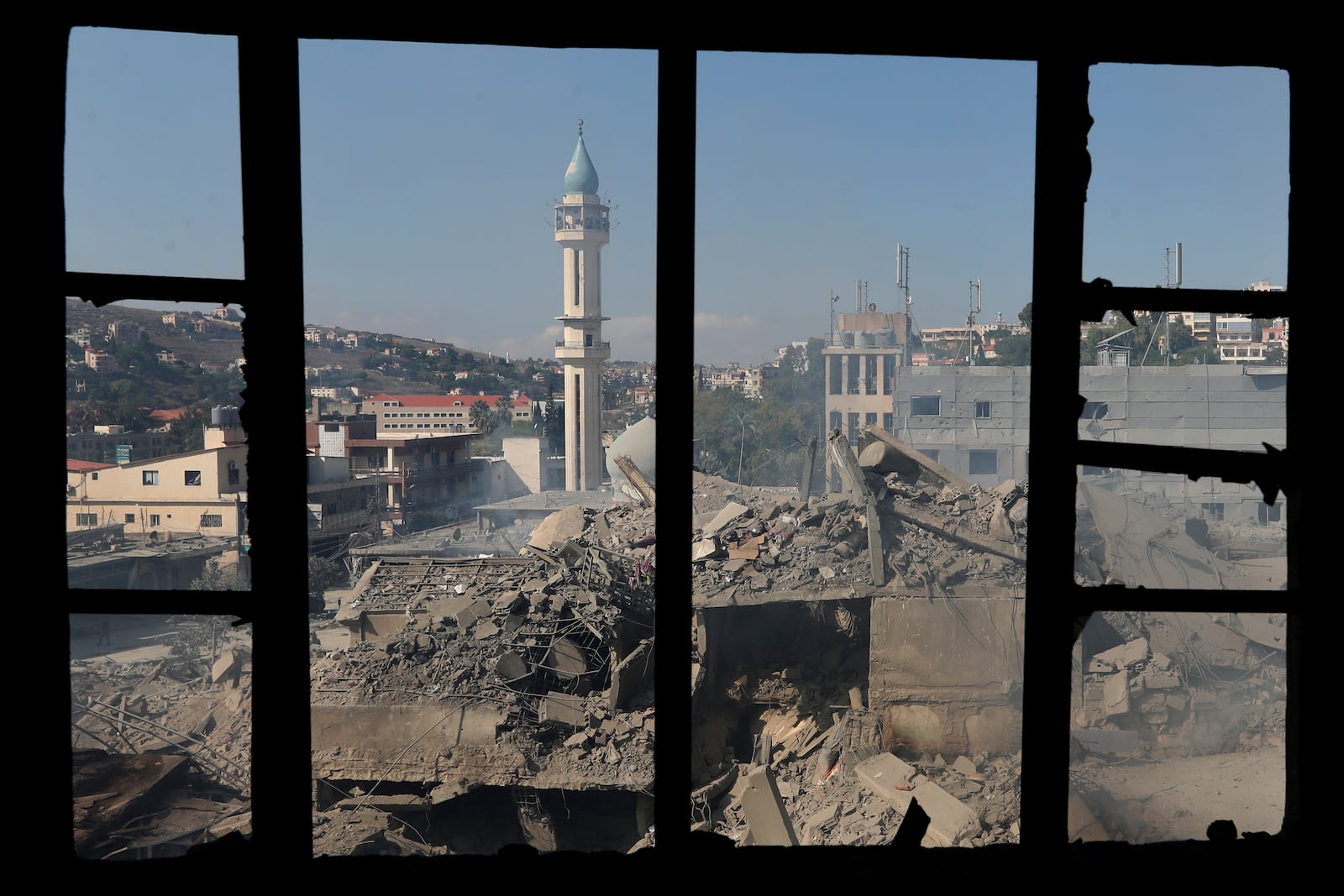 Destroyed buildings at a commercial street that was hit Saturday night by Israeli airstrikes, are seen in Nabatiyeh town, south Lebanon, Sunday, Oct. 13, 2024. (AP Photo/Mohammed Zaatari)