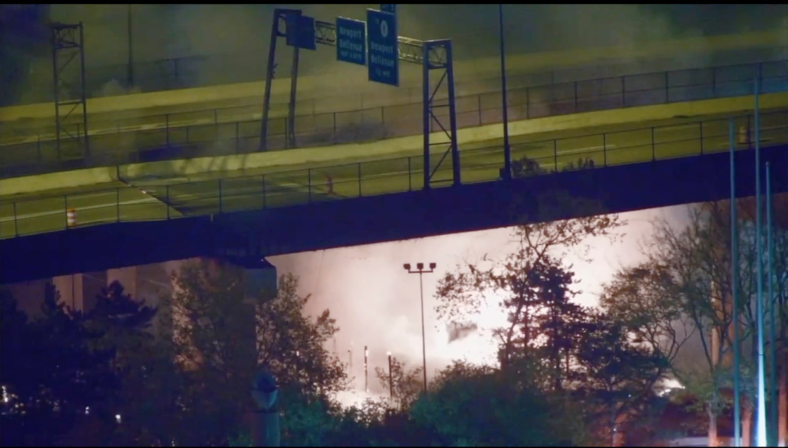 Smoke fills the air from a vehicle fire near the I-471 bridge in Cincinnati early Friday, Nov. 1, 2024. (WCPO via AP)