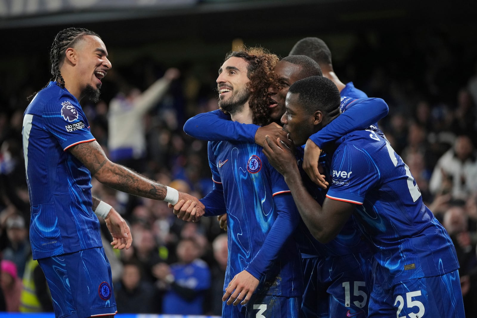 Chelsea's Marc Cucurella, second left, celebrates with teammates after scoring the opening goal of the game during the English Premier League soccer match between Chelsea and Brentford at Stamford Bridge in London, Sunday, Dec. 15, 2024. (AP Photo/Kin Cheung)