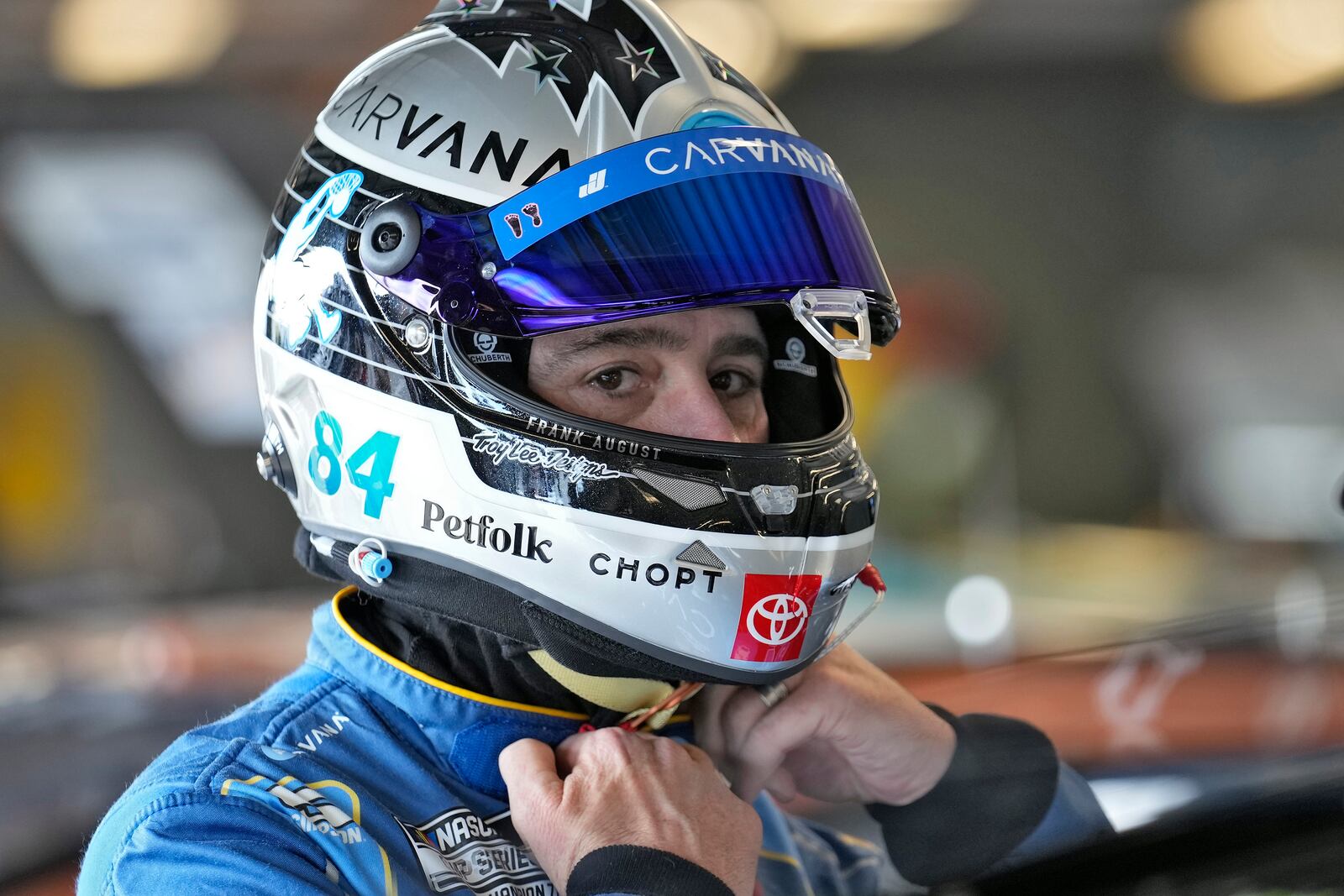 Jimmie Johnson finishes putting on his helmet before a practice for the NASCAR Daytona 500 auto race Wednesday, Feb. 12, 2025, at Daytona International Speedway in Daytona Beach, Fla. (AP Photo/Chris O'Meara)