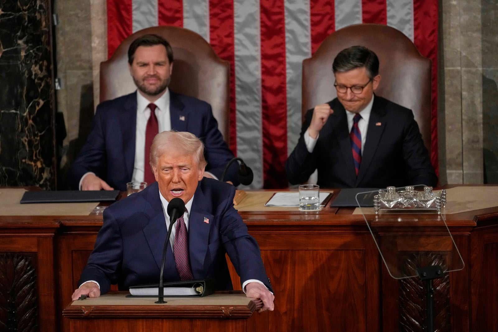 President Donald Trump addresses a joint session of Congress in the House chamber at the U.S. Capitol in Washington, Tuesday, March 4, 2025, as Vice President JD Vance and House Speaker Mike Johnson of La., listen. (AP Photo/Julia Demaree Nikhinson)