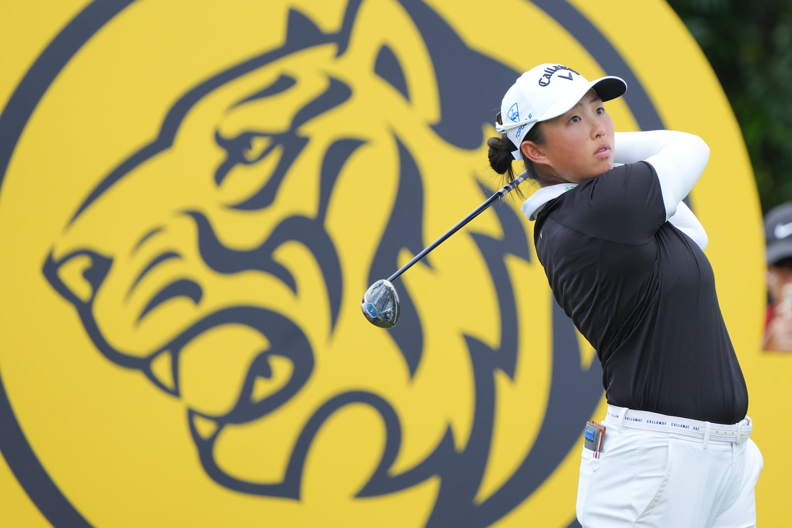 Yin Ruoning of China watches her tee shot on the 16th hole during the LPGA Tour's Maybank Championship at Kuala Lumpur Golf and Country club in Kuala Lumpur, Sunday, Oct. 27, 2024. (AP Photo/Vincent Thian)