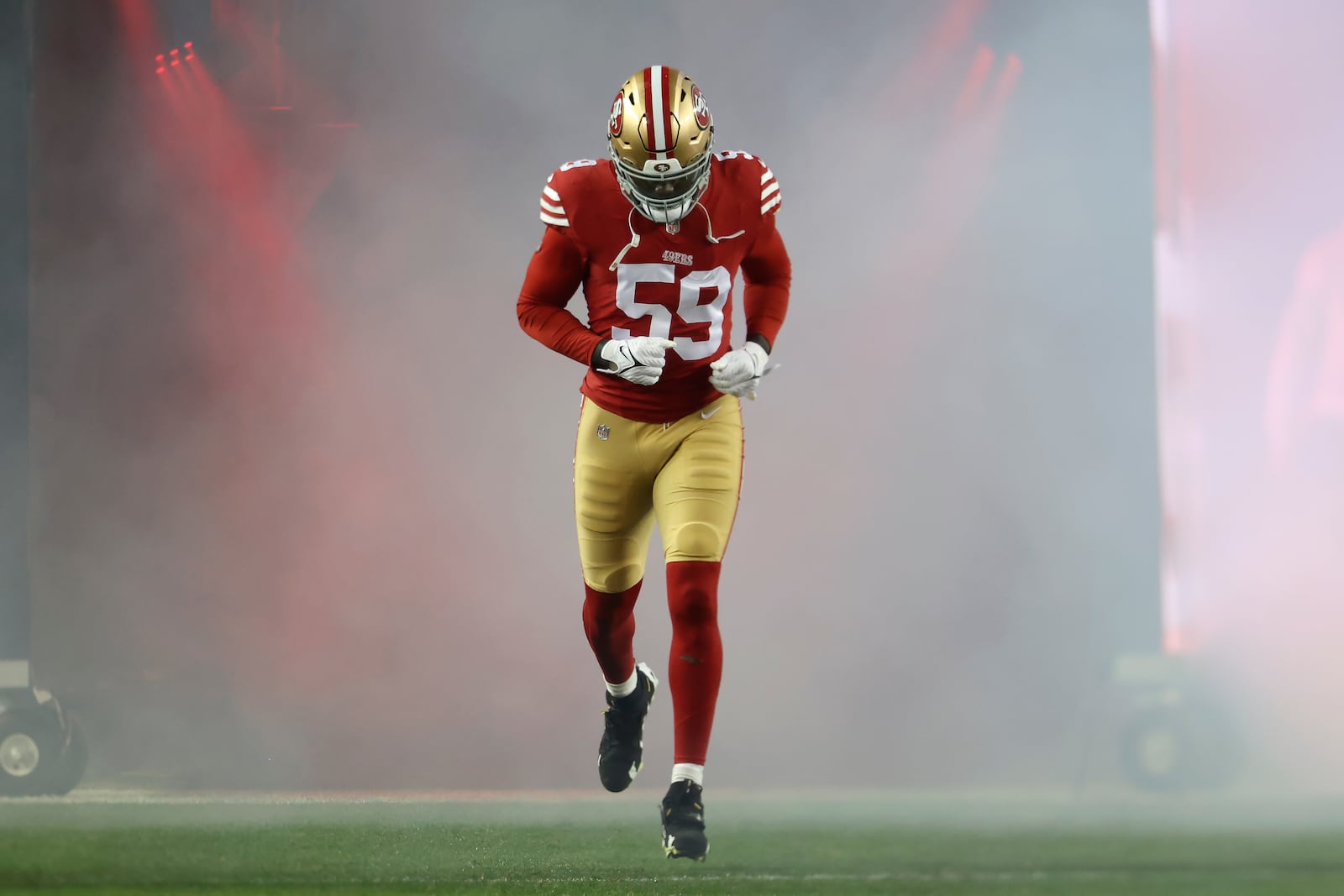 San Francisco 49ers linebacker De'Vondre Campbell jogs onto the field before an NFL football game against the Los Angeles Rams in Santa Clara, Calif., Thursday, Dec. 12, 2024. (AP Photo/Jed Jacobsohn)