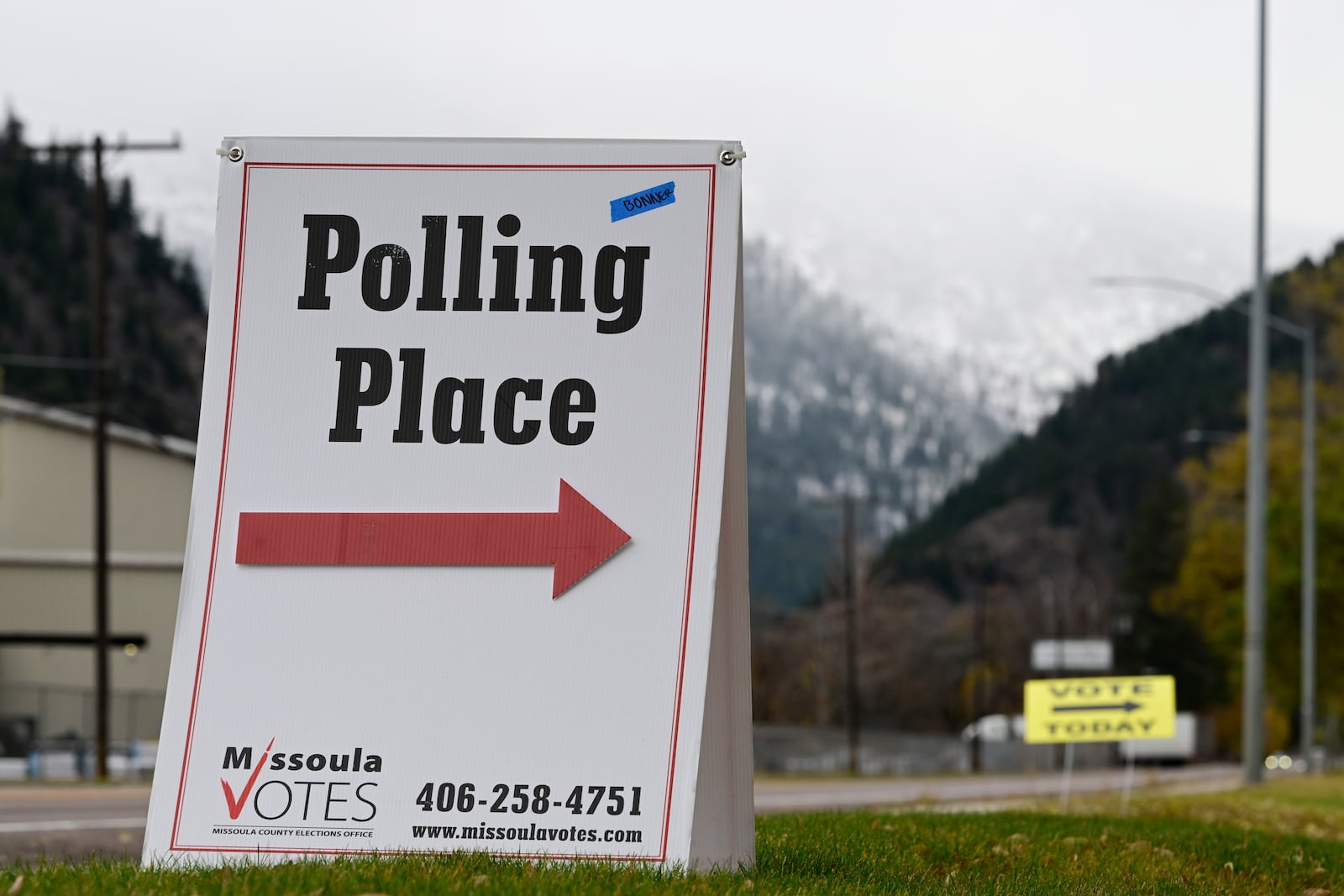 Signs marking a polling place stand in Bonner, Mont., on Election Day, Tuesday, Nov. 5, 2024. (AP Photo/Tommy Martino)