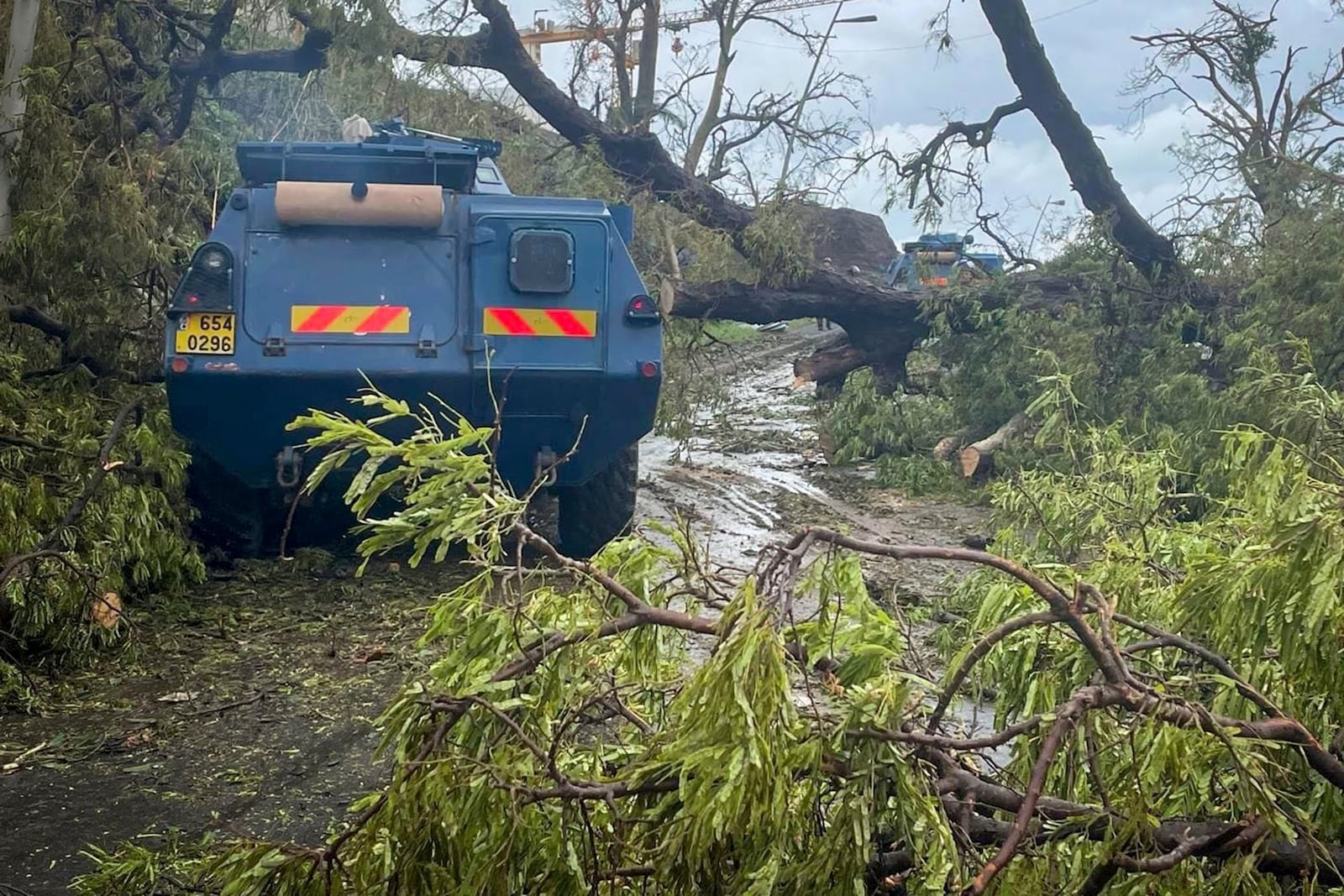 This photo provided Monday, Dec.16, 2024 by the Gendarmerie Nationale shows a vehicle of the Gendarmerie Nationale on a road Sunday, Dec. 15, 2024 in Mayotte as France rushed rescue teams and supplies to its largely poor overseas department in the Indian Ocean that has suffered widespread destruction. (Gendarmerie Nationale via AP)