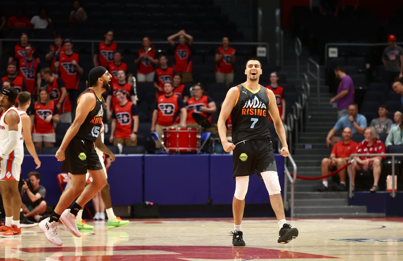 Tajinder Lall, of India Rising, celebrates after making the game-ending shot against the Red Scare in the first round of The Basketball Tournament on Wednesday, July 26, 2023, at UD Arena in Dayton. David Jablonski/Staff