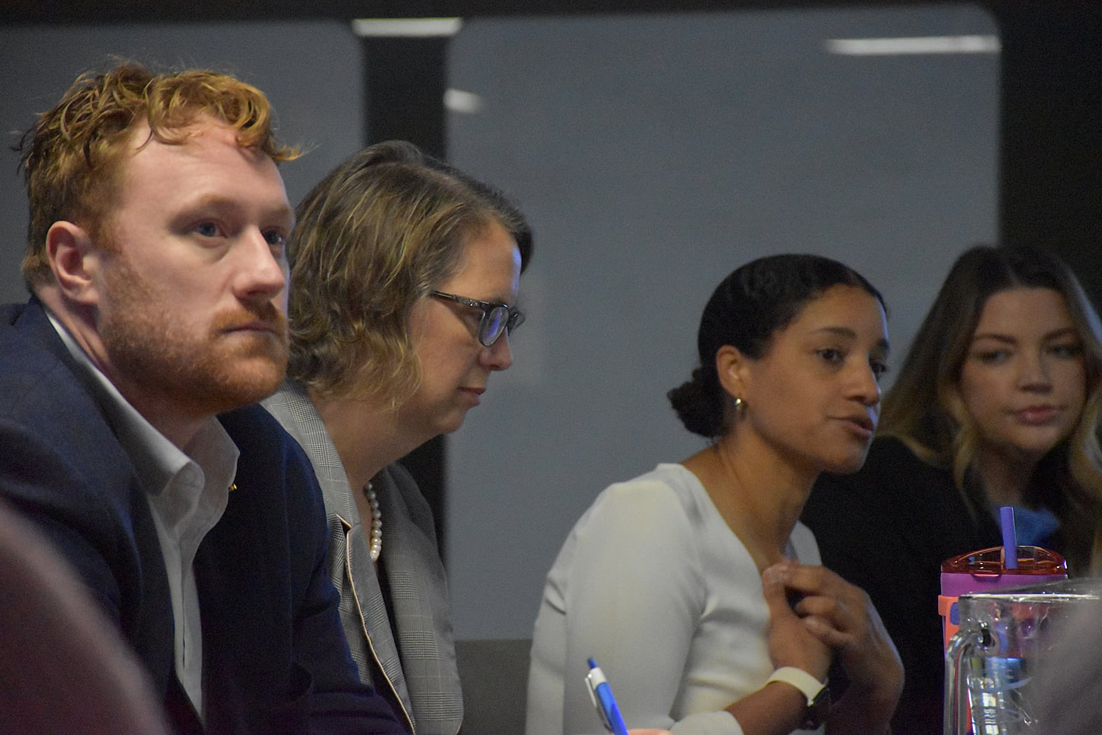 Dayton Municipal Clerk Marty Gehres, ABLE senior attorney Debra Debra Lavey and Erica Fields and Emma Smales with Learn to Earn discuss a new Right to Counsel eviction prevention pilot program in northwest Dayton. CORNELIUS FROLIK / STAFF