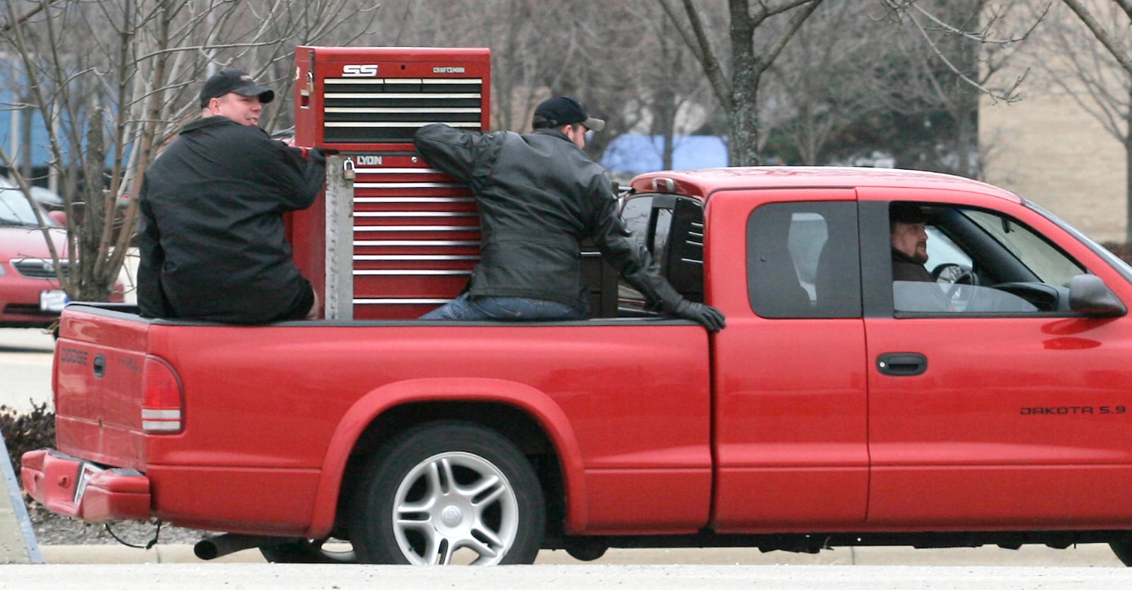 Skilled tradesmen remove their tool chests from the GM Moraine Assembly Plant on its final day of production Tuesday, Dec. 23, 2008.