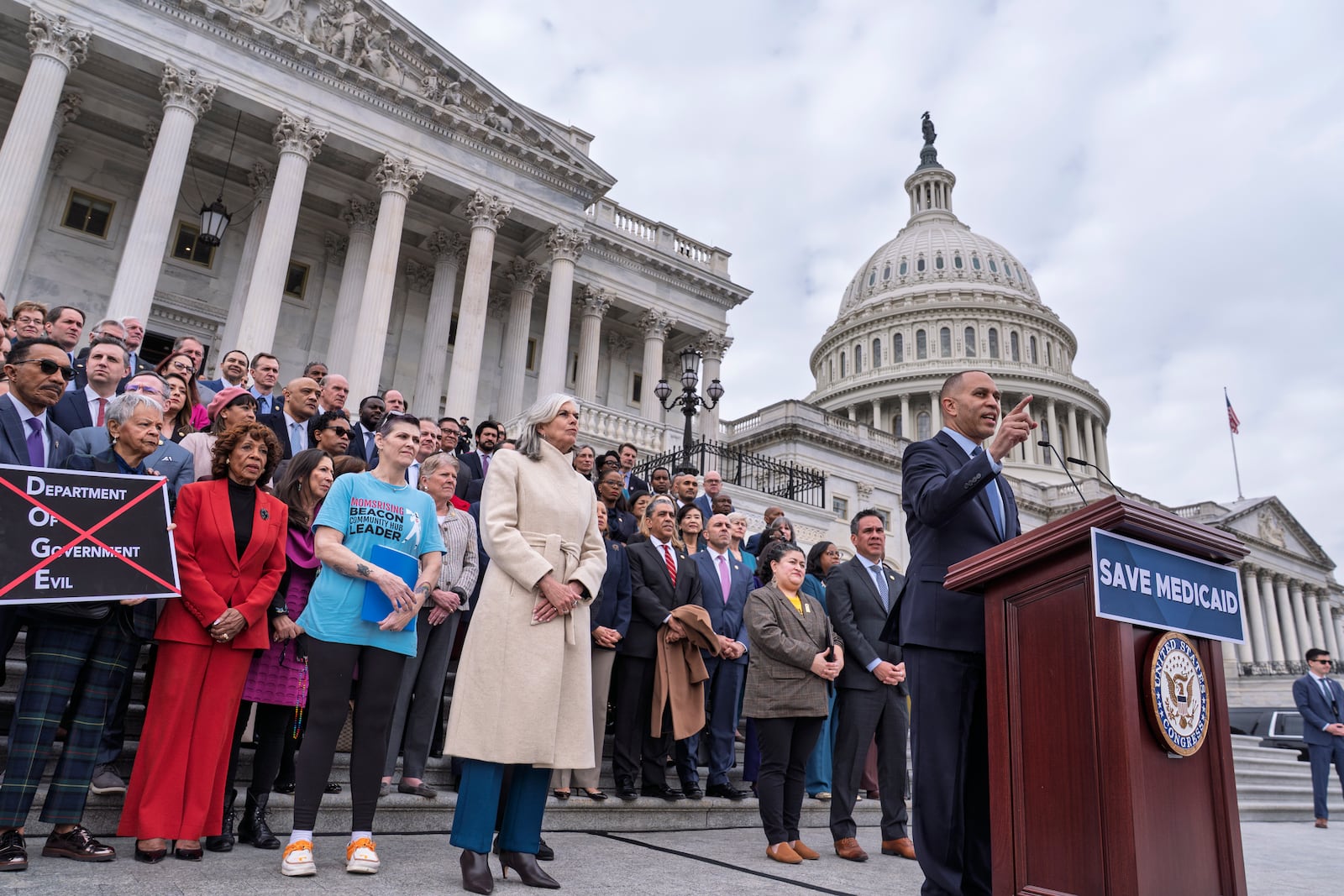 House Minority Leader Hakeem Jeffries, D-N.Y., right, joined at center left by Rep. Katherine Clark, D-Mass., the House minority whip, speaks against the Republican budget plan, on the House steps at the Capitol in Washington, Tuesday, Feb. 25, 2025. (AP Photo/J. Scott Applewhite)