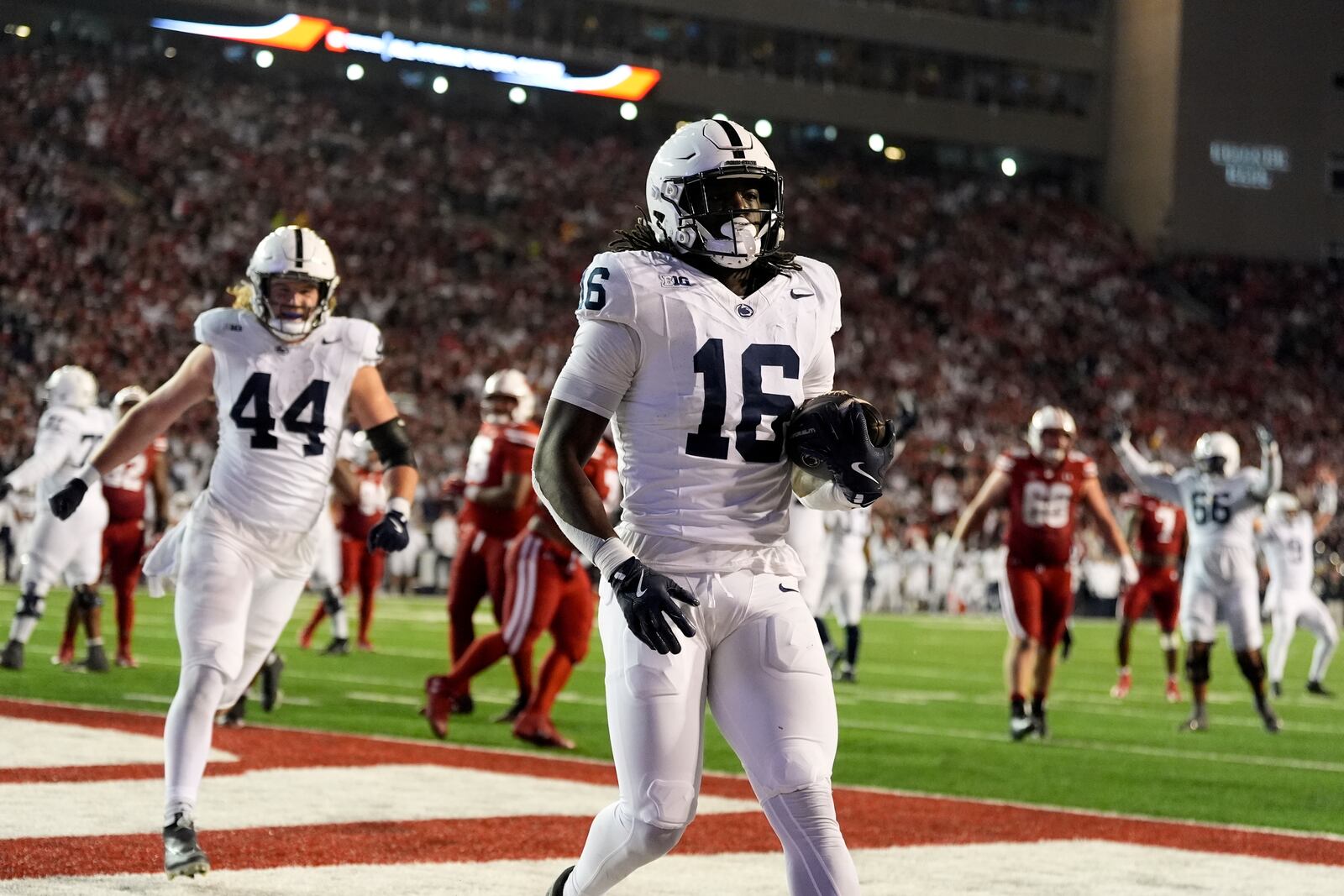 Penn State's Khalil Dinkins (16) catches a touchdown pass during the second half of an NCAA college football game against the Wisconsin Saturday, Oct. 26, 2024, in Madison, Wis. (AP Photo/Morry Gash)