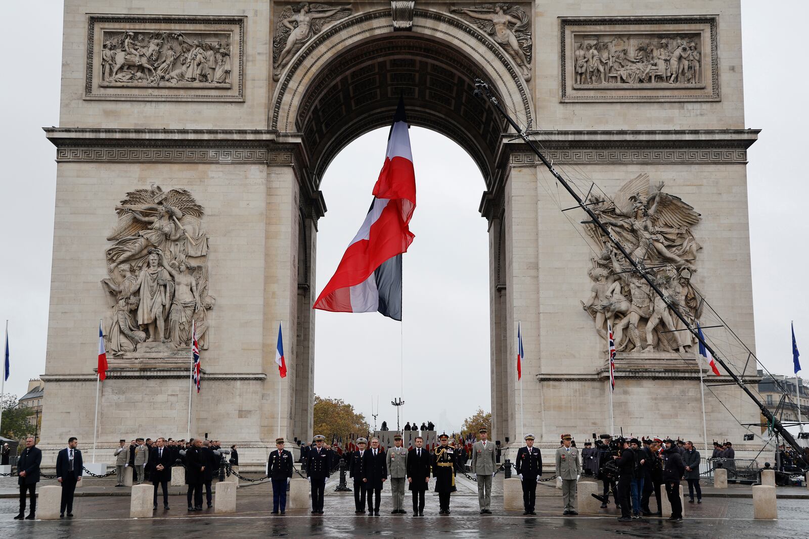 French President Emmanuel Macron, center right, French Chief of Staff of the Armed Forces Thierry Burkhard, center, and Britain's Prime Minister Keir Starmer stand at attention as Republican Guards parade by the Arc de Triomphe during commemorations marking the 106th anniversary of the November 11, 1918, Armistice, ending World War I, in Paris, Monday, Nov. 11, 2024. ( Ludovic Marin, Pool via AP)