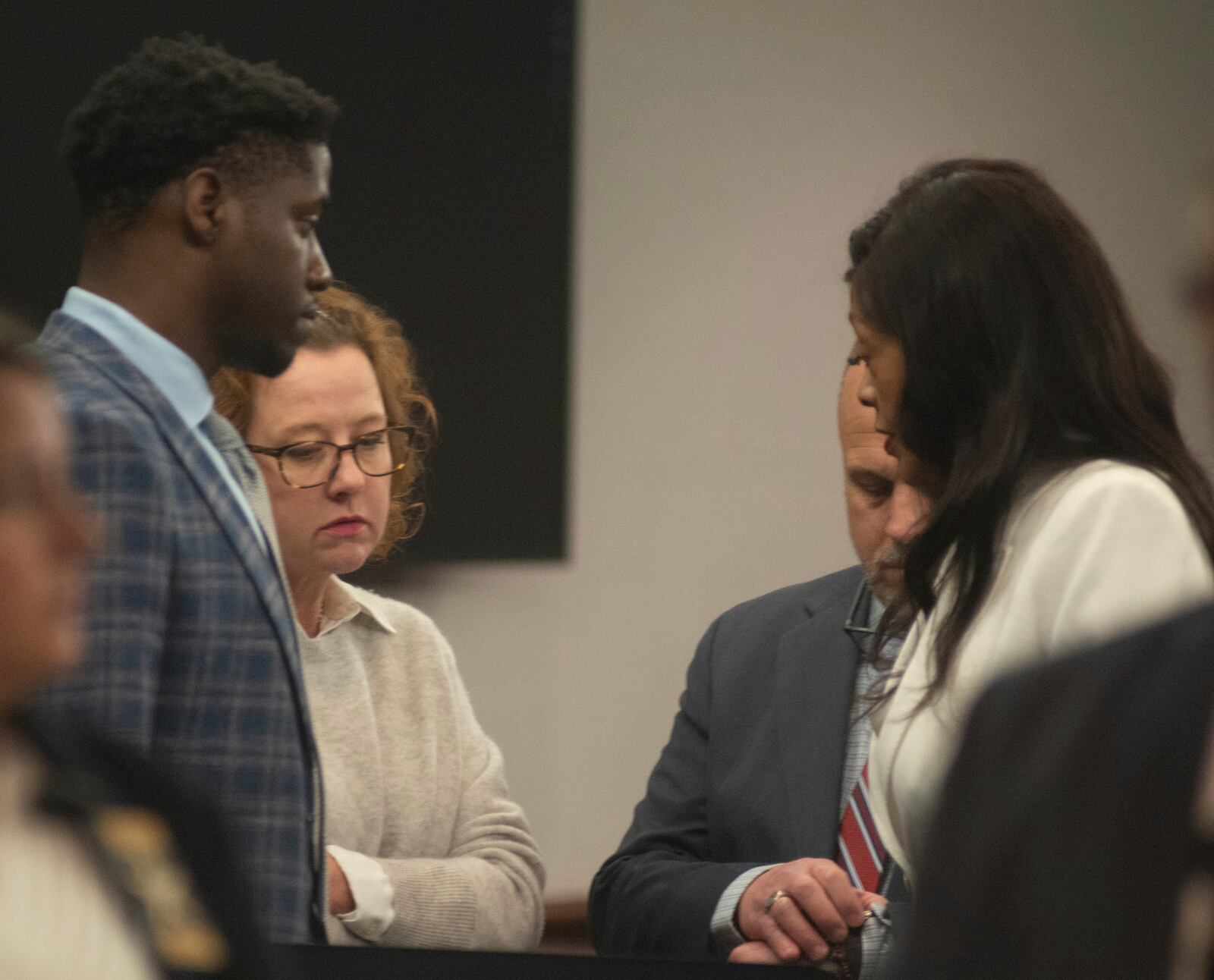 Former Brunswick Circuit District Attorney Jackie Johnson stands somberly among her legal team waiting to leave the courtroom after trial Judge John R. Turner granted a defense motion dismissing the only remaining charge against her, one of violating her oath of office, Wednesday, Feb. 5, 2025, in Brunswick, Ga. (Terry Dickson/The Brunswick News via AP, Pool)