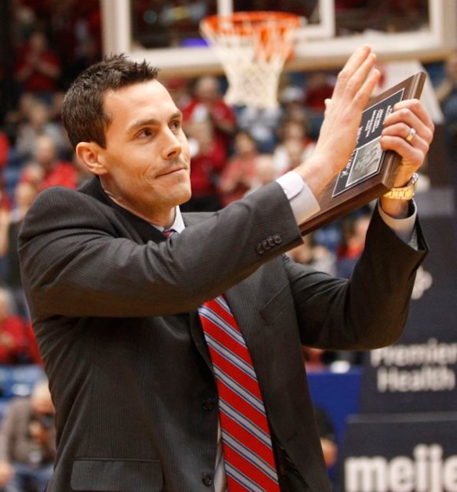 Former UD basketball player Keith Waleskowski acknowledges the crowd as he’s inducted into the Dayton Hall of Fame on Saturday, March 8, 2014, at UD Arena. David Jablonski/Staff