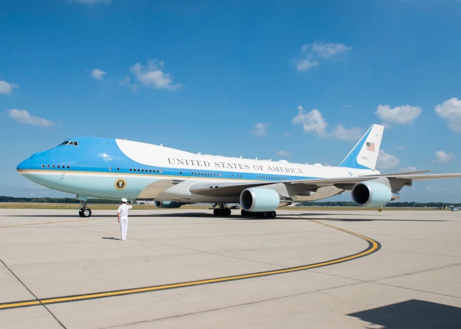 President Trump’s military aide presents arms while Air Force One taxis to the red carpet at Wright-Patterson Air Force Base, Aug. 7, 2019. Trump landed at Wright-Patt to visit first responders and survivors in Dayton after the mass shooting on Aug. 4. (U.S. Air Force photo by Wesley Farnsworth)