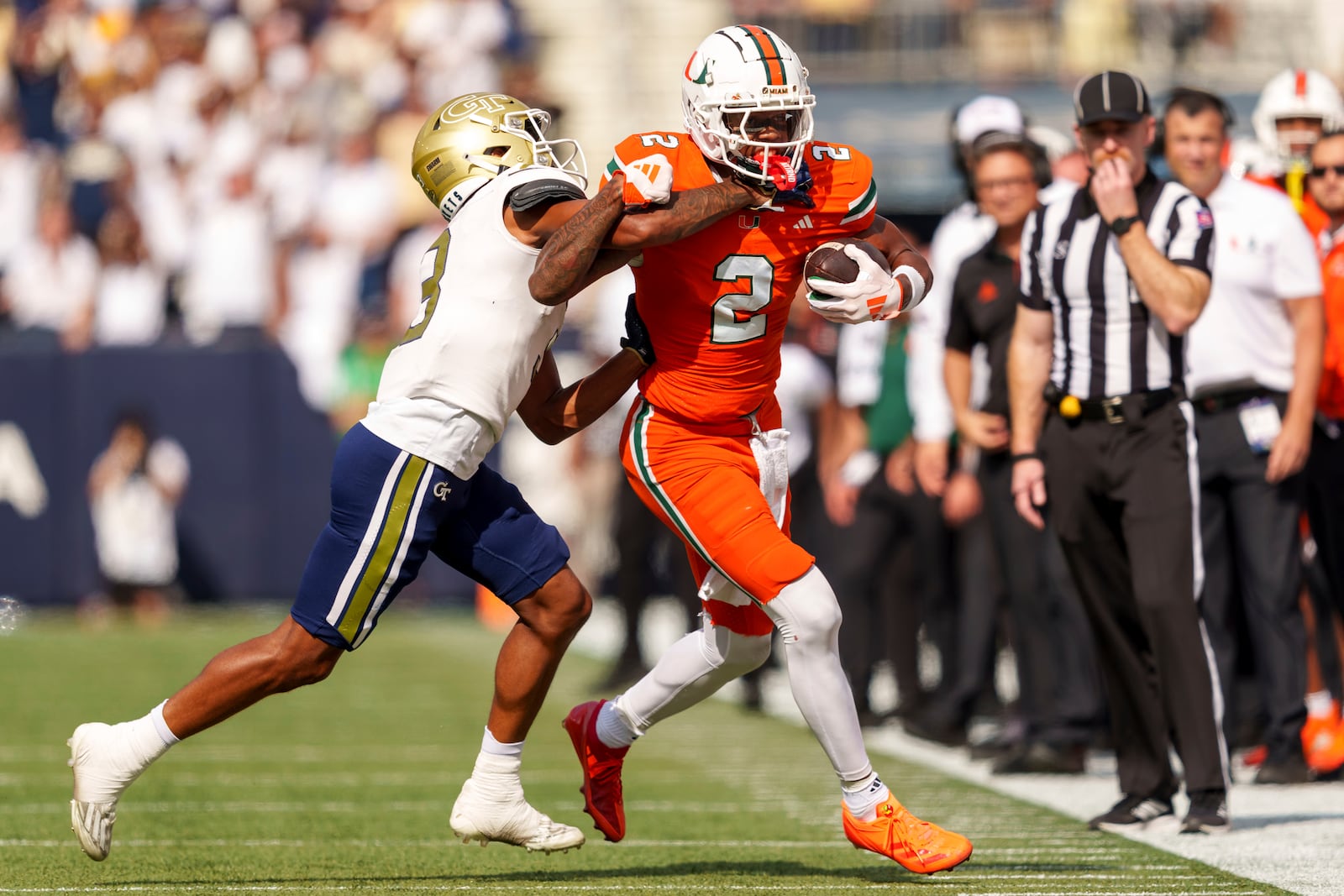 Miami wide receiver Isaiah Horton (2) is pushed out of bounds by Georgia Tech defensive back Ahmari Harvey (3) during the first half of an NCAA college football game, Saturday, Nov. 9, 2024, in Atlanta. (AP Photo/Jason Allen)