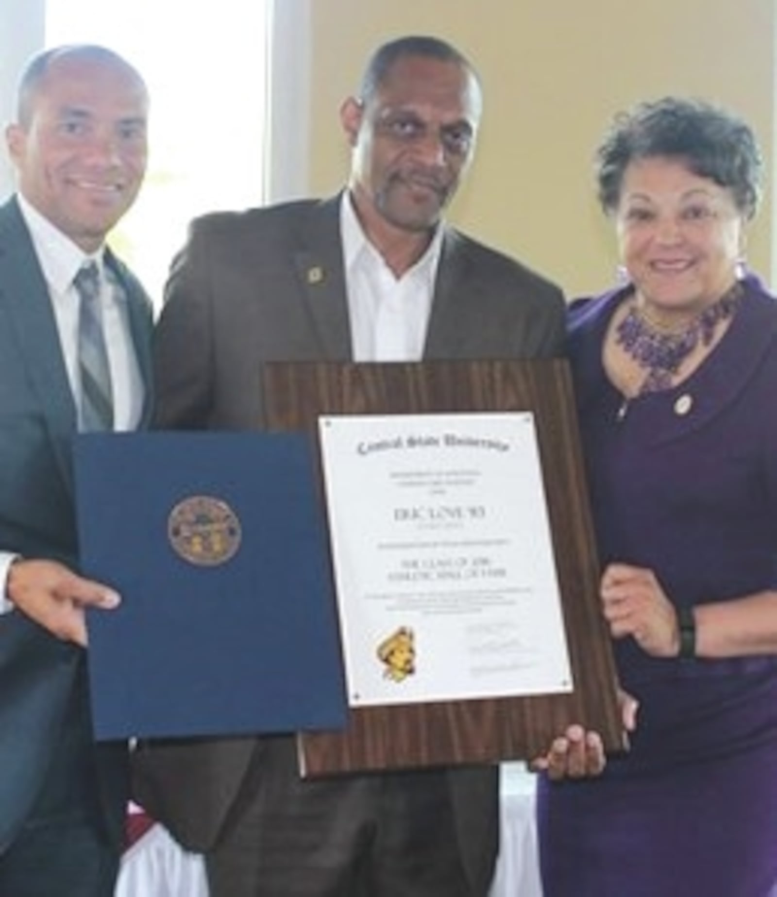 Eric Love (center) at his Central State Hall of Fame induction with then VP of Athletics Jahan Culbreath and former CSU President, Cynthia Jackson Hammond. CONTRIBUTED