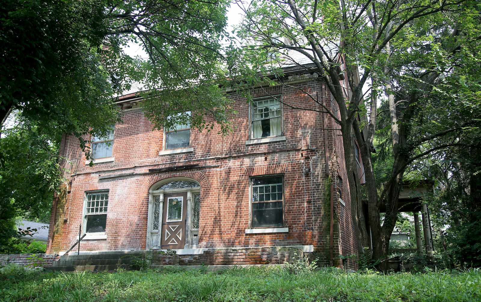 Judge Edward T. Snediker built this brick Georgian-style home in the Dayton View Historic District in 1905. Snediker died on Oct 19, 1939. The property was added to the National Register of Historic Places in 1984. LISA POWELL / STAFF
