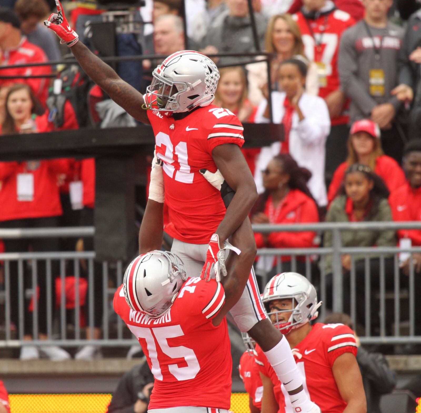 Ohio State’s Parris Campbell gets a lift from Thayer Munford after scoring the first touchdown of the game against Tulane on Saturday, Sept. 22, 2018, at Ohio Stadium in Columbus. David Jablonski/Staff