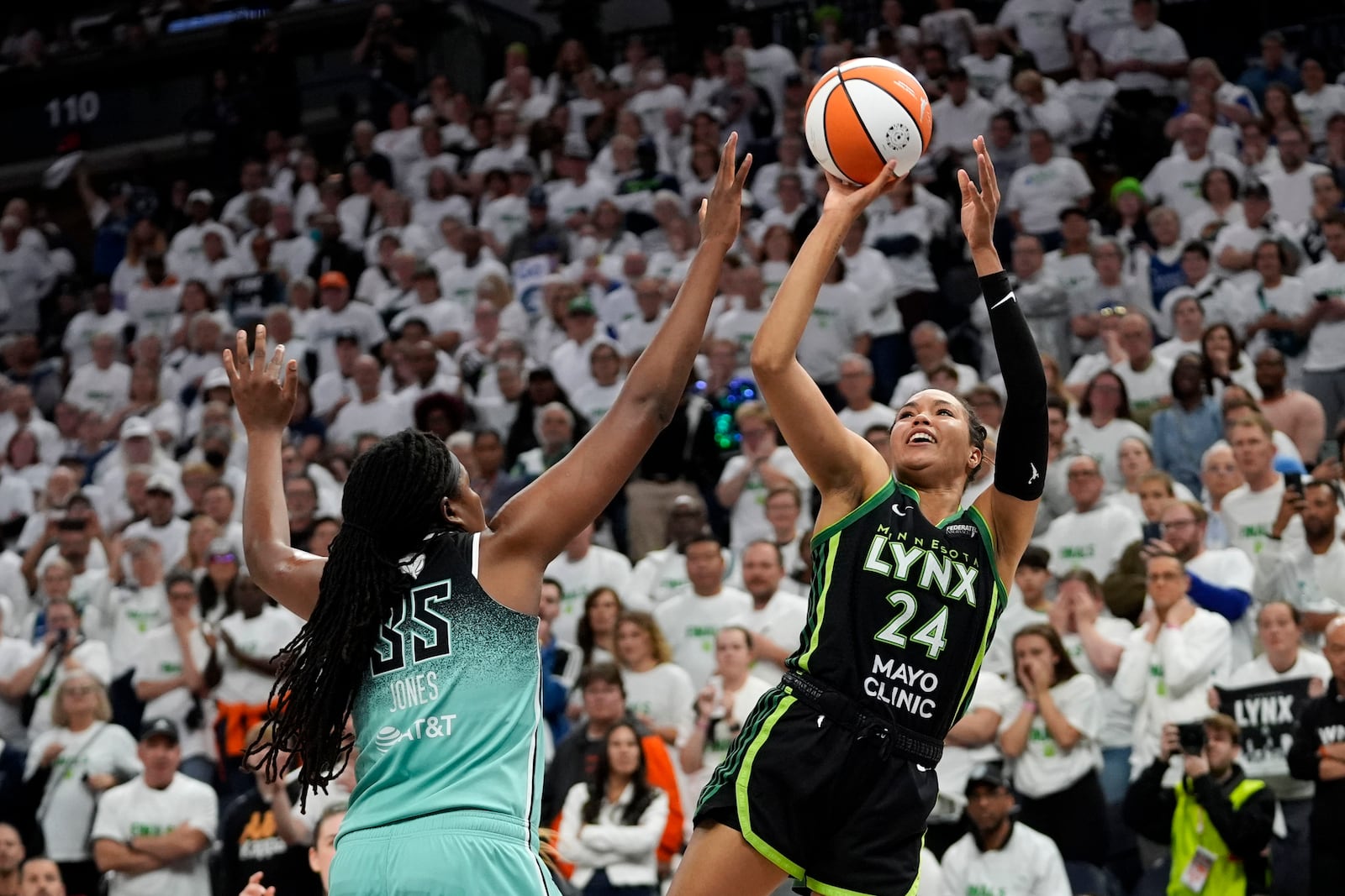 Minnesota Lynx forward Napheesa Collier (24) shoots over New York Liberty forward Jonquel Jones (35) during the second half in Game 3 of a WNBA basketball final playoff series, Wednesday, Oct. 16, 2024, in Minneapolis. (AP Photo/Abbie Parr)