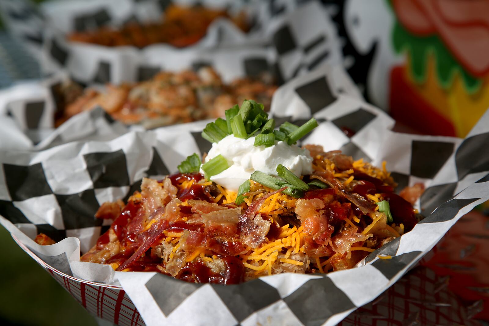 Pulled Pork Fries are on the menu at T's Heavenly Taste, a food truck founded by Terri Gates in 2018.  Hand-cut fries are topped with smoked pork, bacon, cheddar cheese, homemade barbeque sauce, sour cream and green onions. LISA POWELL / STAFF