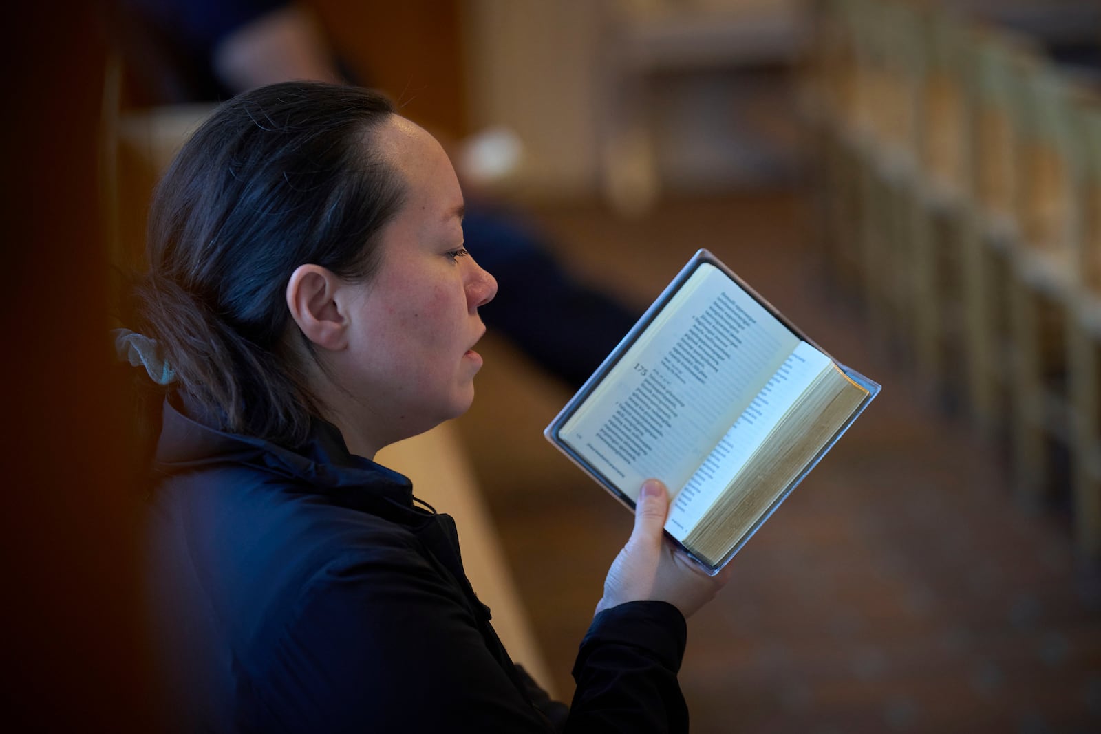 A worshipper sings a religious song during a service in Nuuk, Greenland, Sunday, Feb. 16, 2025. (AP Photo/Emilio Morenatti)