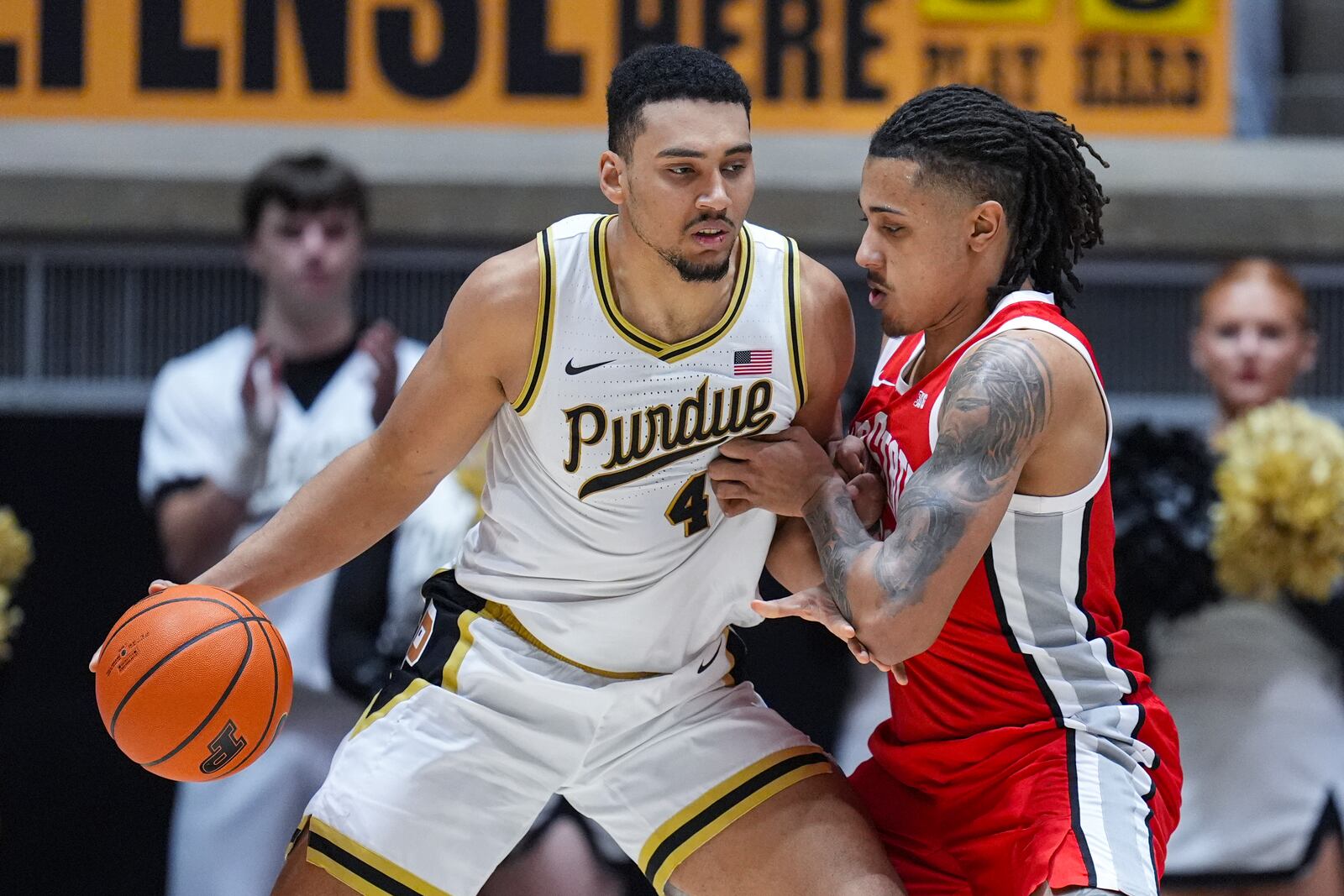 Purdue forward Trey Kaufman-Renn (4) drives against Ohio State forward Devin Royal (21) during the first half of an NCAA college basketball game in West Lafayette, Ind., Tuesday, Jan. 21, 2025. (AP Photo/Michael Conroy)