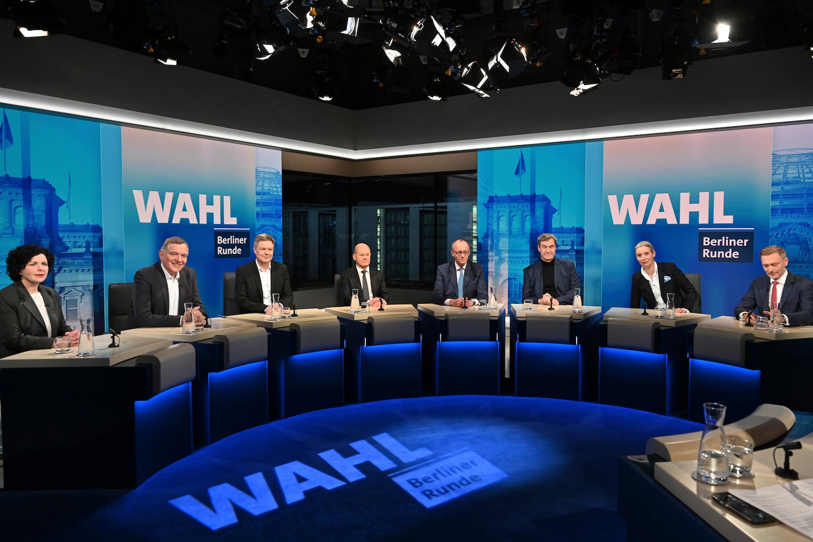 From left, Amira Mohamed Ali, co-leader of the Sahra Wagenknecht Alliance (BSW), Jan van Aken, co-leader of the Left Party (Die Linke), Robert Habeck, Vice Chancellor and member of the Greens, German Chancellor Olaf Scholz, Friedrich Merz, leader of the Christian Democratic Union (CDU), Markus Soeder, leader of the German Christian Social Union, (CSU), Alice Weidel, co-leader of the Alternative for Germany Party (AfD) and Christian Lindner, leader of the Free Democratic Party (FDP), attend a tv discussion after the national election in Berlin, Germany, Sunday, Feb. 23, 2025. (Stefanie Loos/Pool Photo via AP)