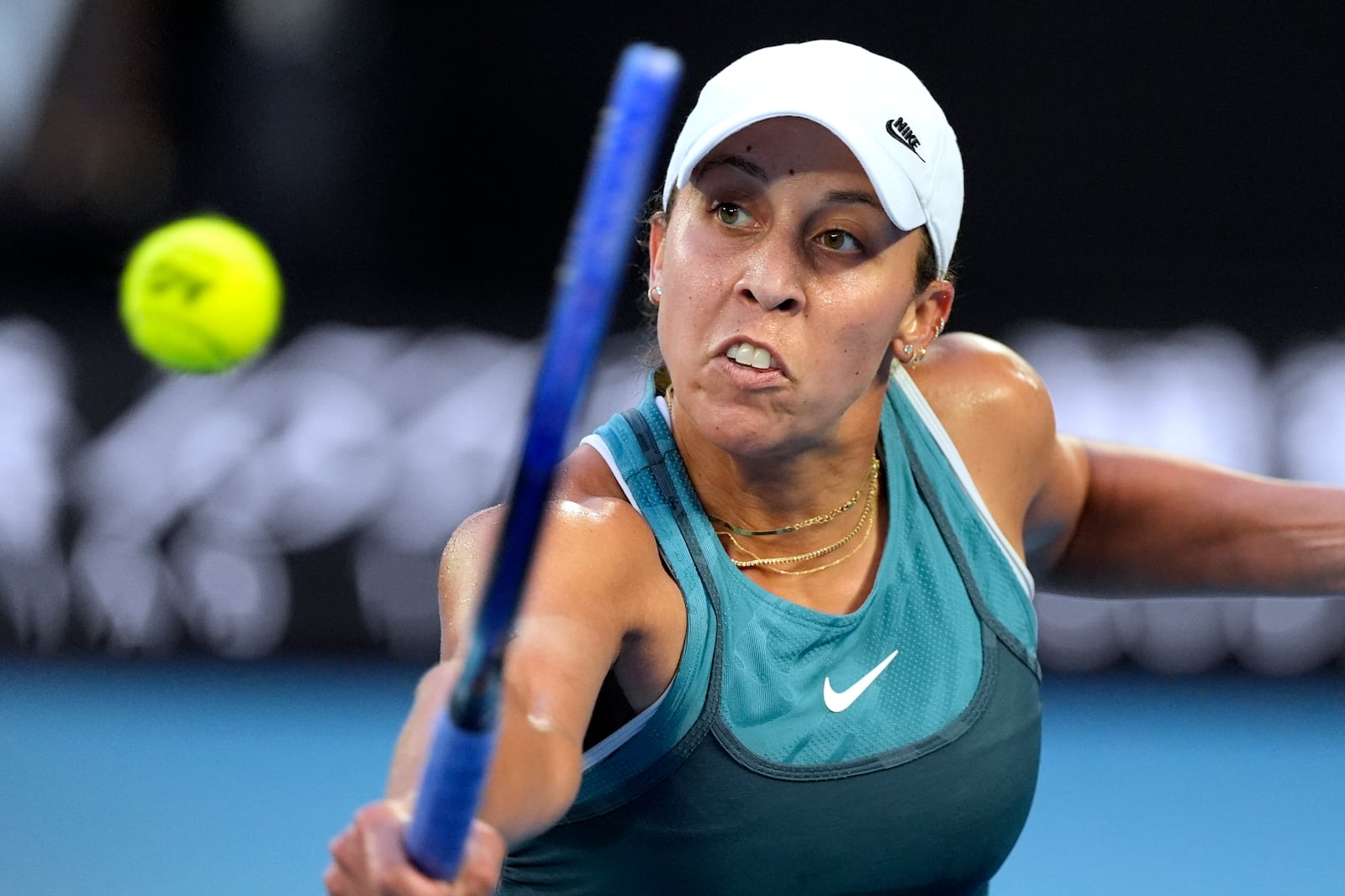 Madison Keys of the U.S. plays a backhand return to Aryna Sabalenka of Belarus during the women's singles final at the Australian Open tennis championship in Melbourne, Australia, Saturday, Jan. 25, 2025. (AP Photo/Asanka Brendon Ratnayake)