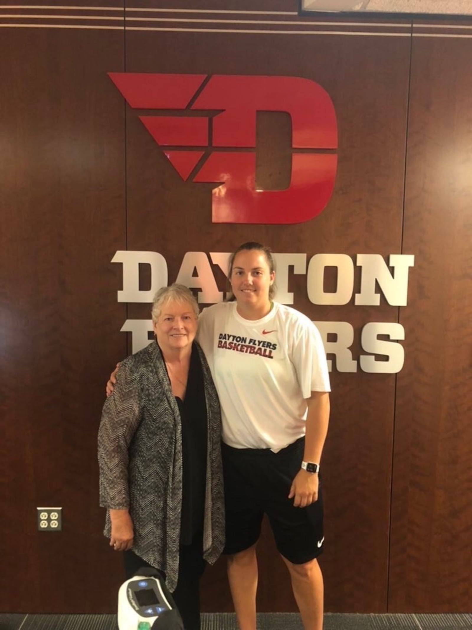 Linda Waltz with former Dayton Flyers guard Sam MacKay, who is well into a pro career. MacKay came to visit Waltz recently at the UD women’s basketball offices. MacKay graduated from UD in 2013 after playing 115 games for the Flyers. Her pro career has taken her to Hungary, France Estonia, Slovakia and now Greece, where this past season she played with “Miss Linda” written on her shoes. CONTRIBUTED