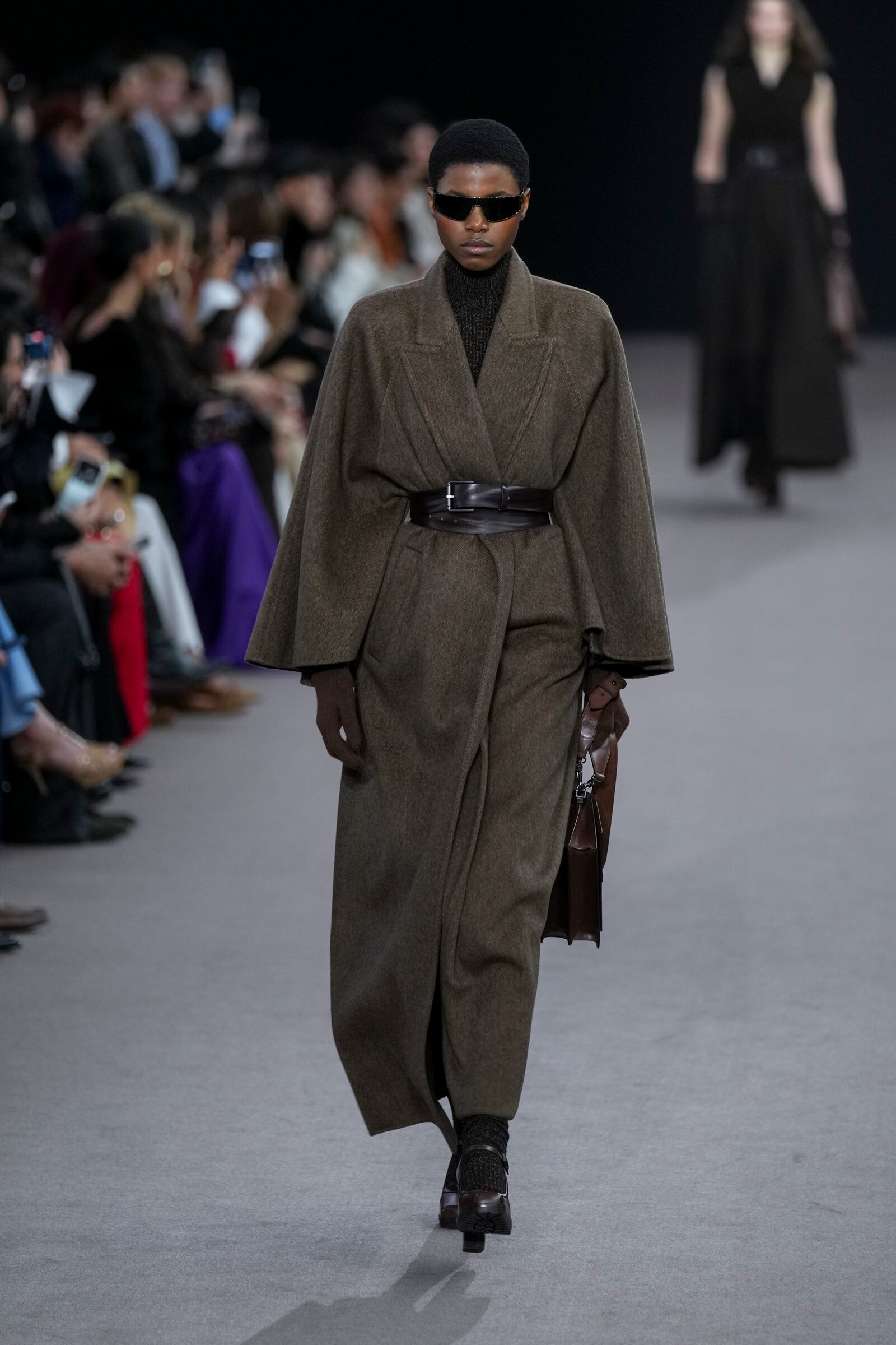 A model wears a creation as part of the Max Mara Fall/Winter 2025-2026 Womenswear collection presented in Milan, Italy, Thursday, Feb. 27, 2025. (AP Photo/Antonio Calanni)