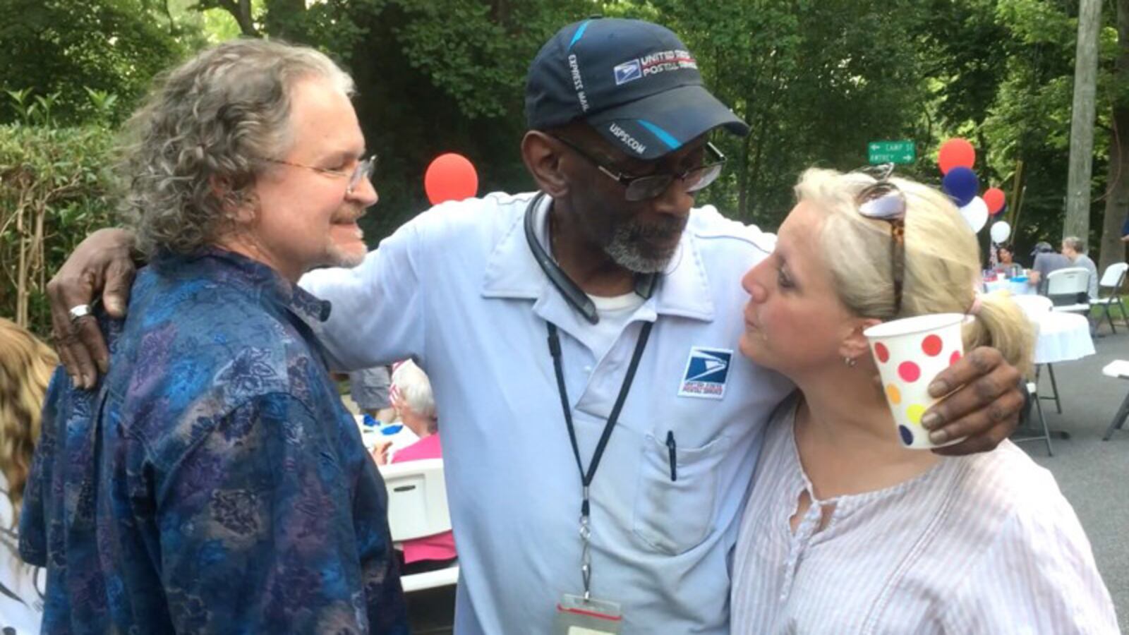 Floyd Martin with Michael and Mamie Hodnett at his retirement party.